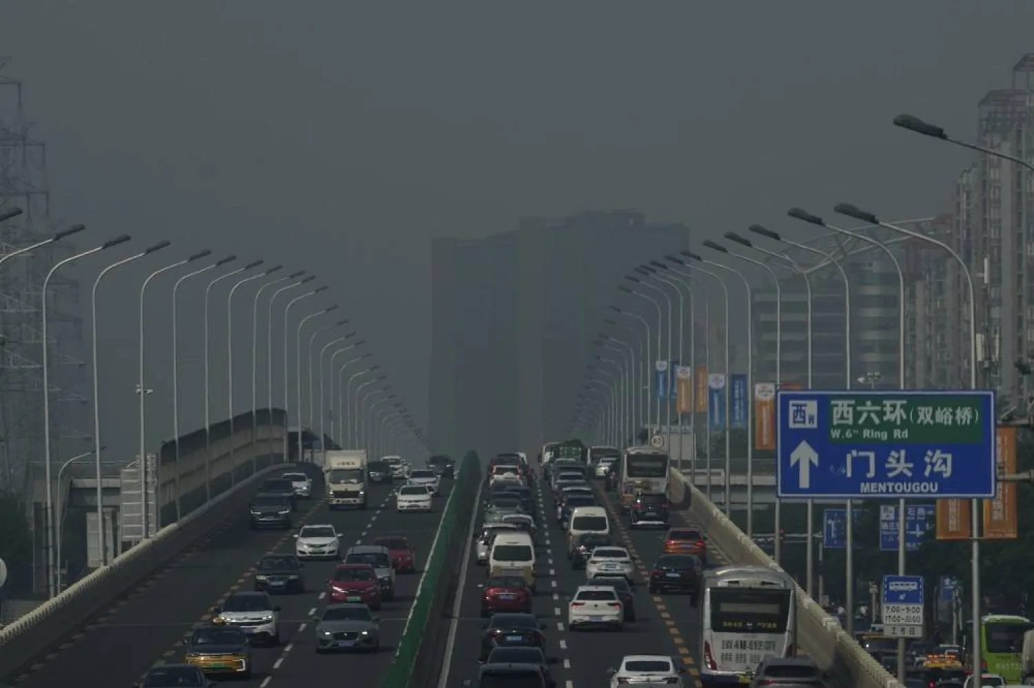 Vehicles travel on a flyover bridge in Beijing, China, Thursday, Sept. 11, 2025. (AP)