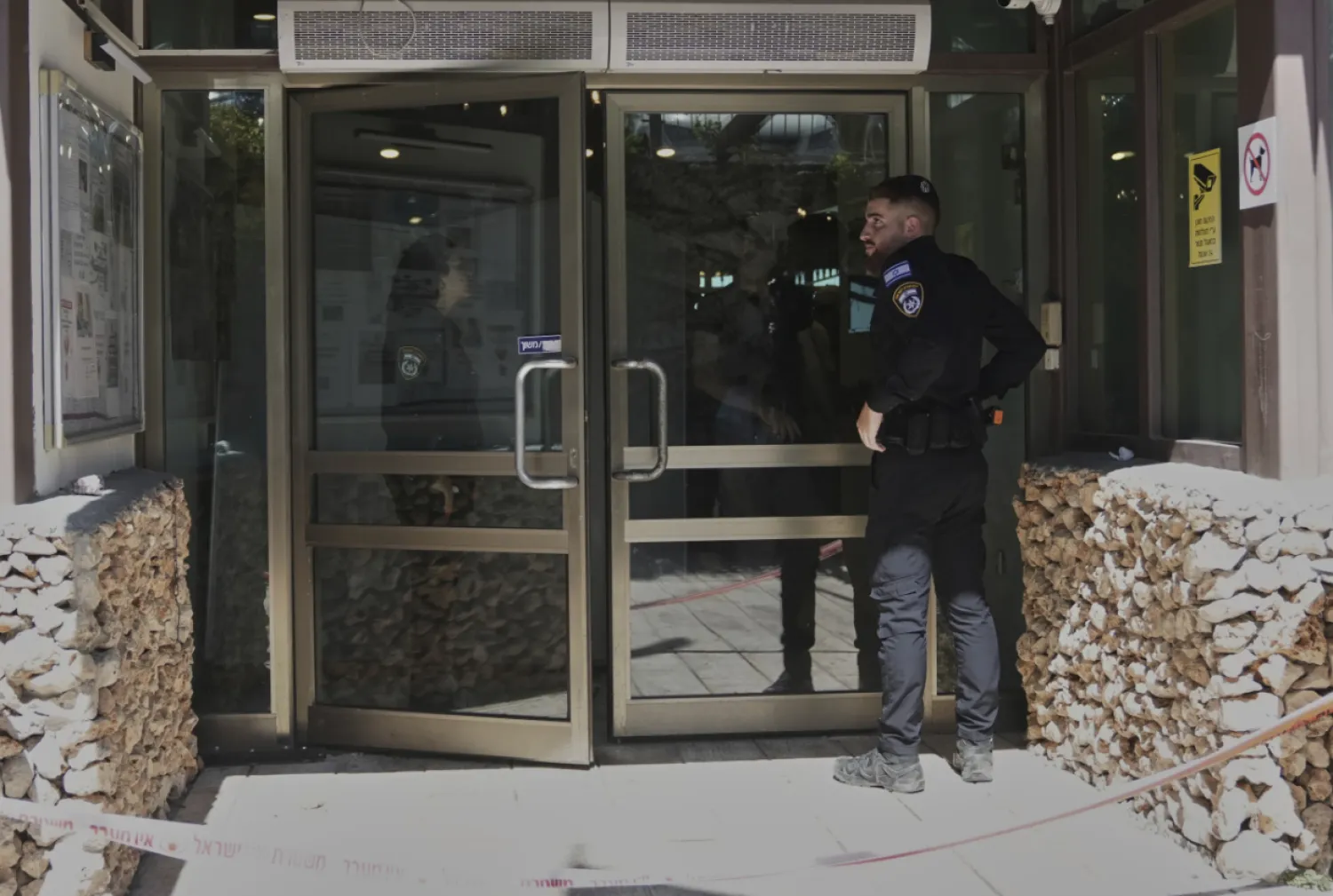 Members of the Israeli security forces work at the scene of a stabbing attack at a hotel in the Kibbutz Tzova, outside Jerusalem, Friday, Sept. 12, 2025. (AP Photo/Mahmoud Illean)
