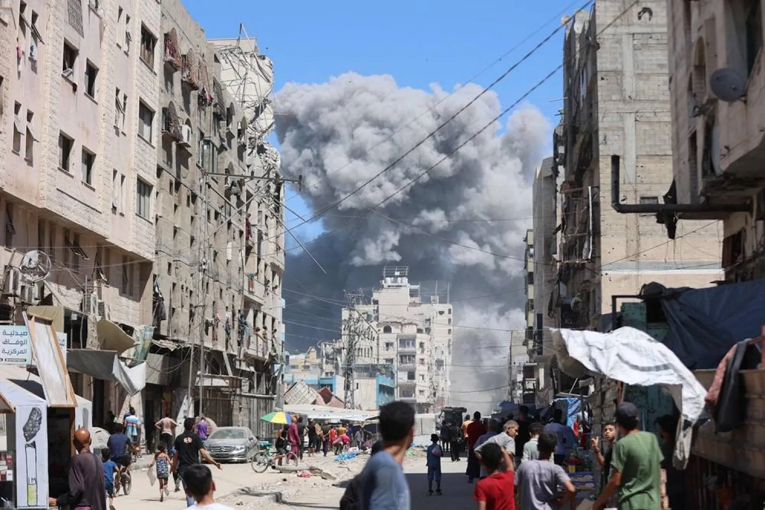 Smoke billows after an Israeli strike on Al-Nassr Street in Gaza City on September 12, 2025. (AFP) 