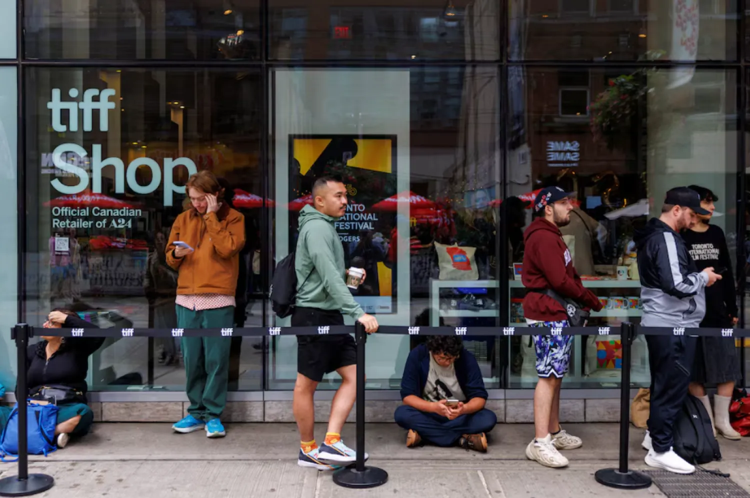 People wait in a rush line for tickets on Kings Street as the Toronto International Film Festival (TIFF) returns for its 50th edition in Toronto, Ontario, Canada September 4, 2025. REUTERS/Carlos Osorio 