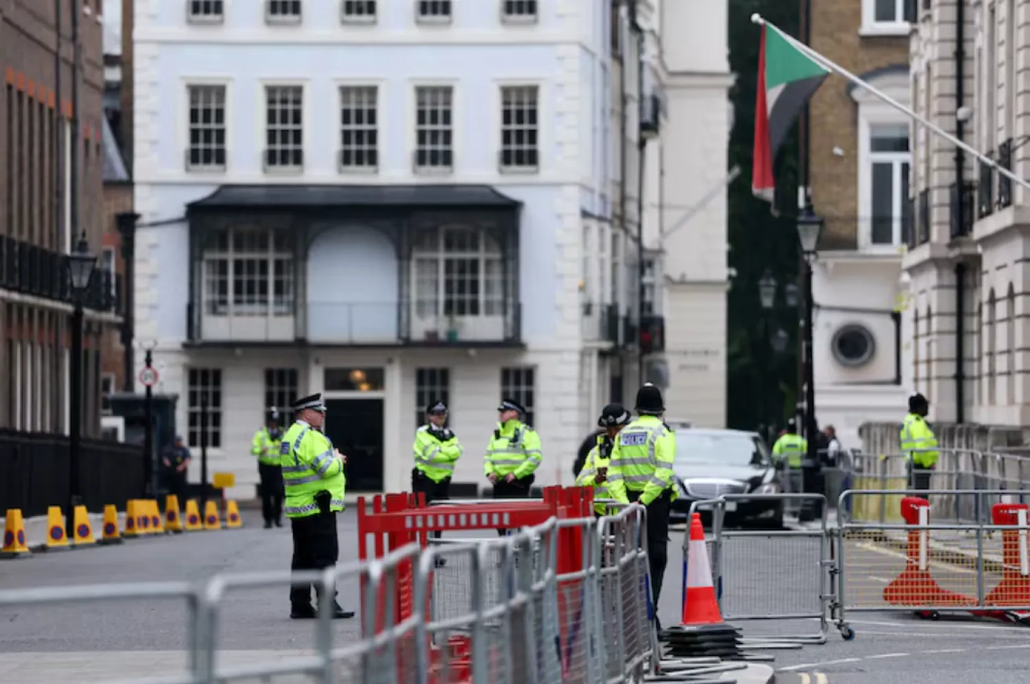 Police officers stand on duty at a security cordon near Lancaster House, in London, Britain, June 9, 2025. REUTERS/Toby Melville 