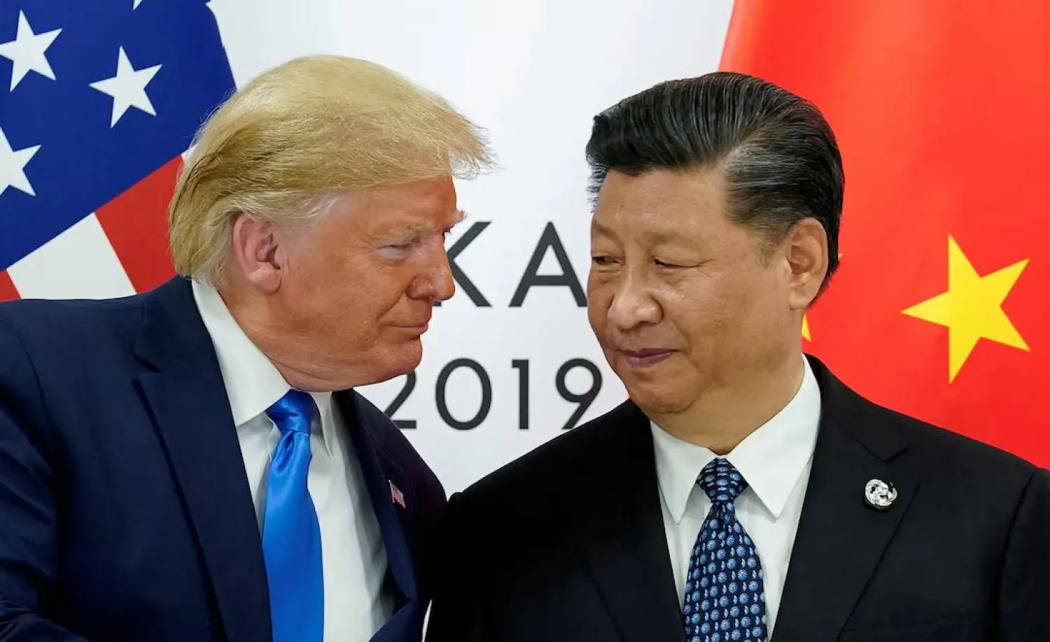 ABD Başkanı Donald Trump ile Çinli mevkidaşı Şi Cinping arasında daha önce yapılan bir görüşme (Arşiv- Reuters)