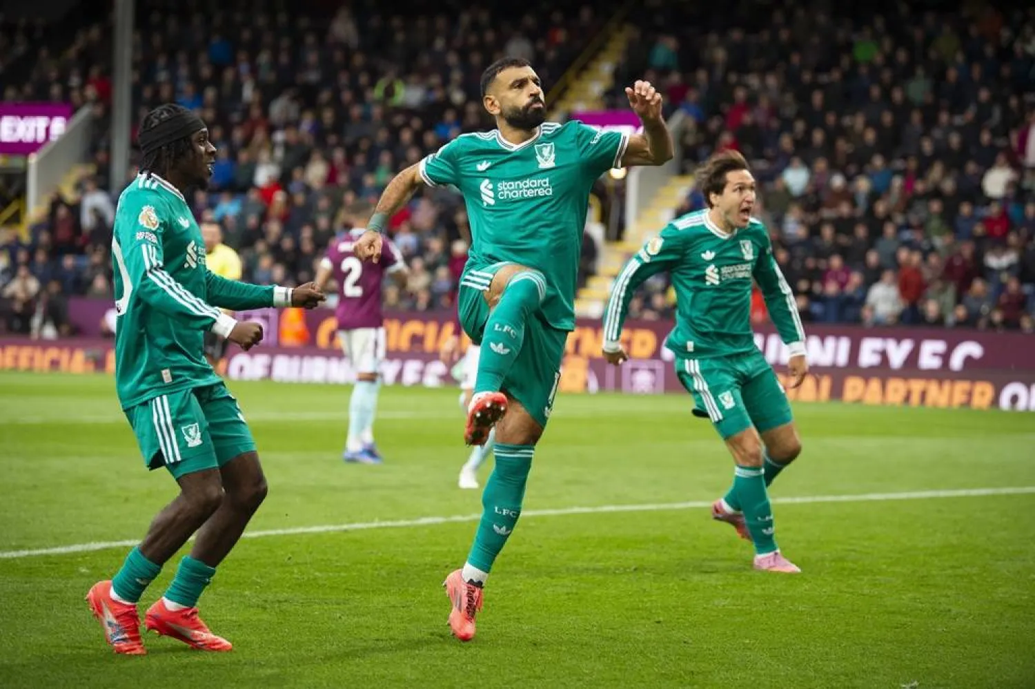 Mohamed Salah of Liverpool celebrates scoring the 1-0 goal during the English Premier League soccer match between Burnley and Liverpool, in Burnley, Britain, 14 September 2025. (EPA)