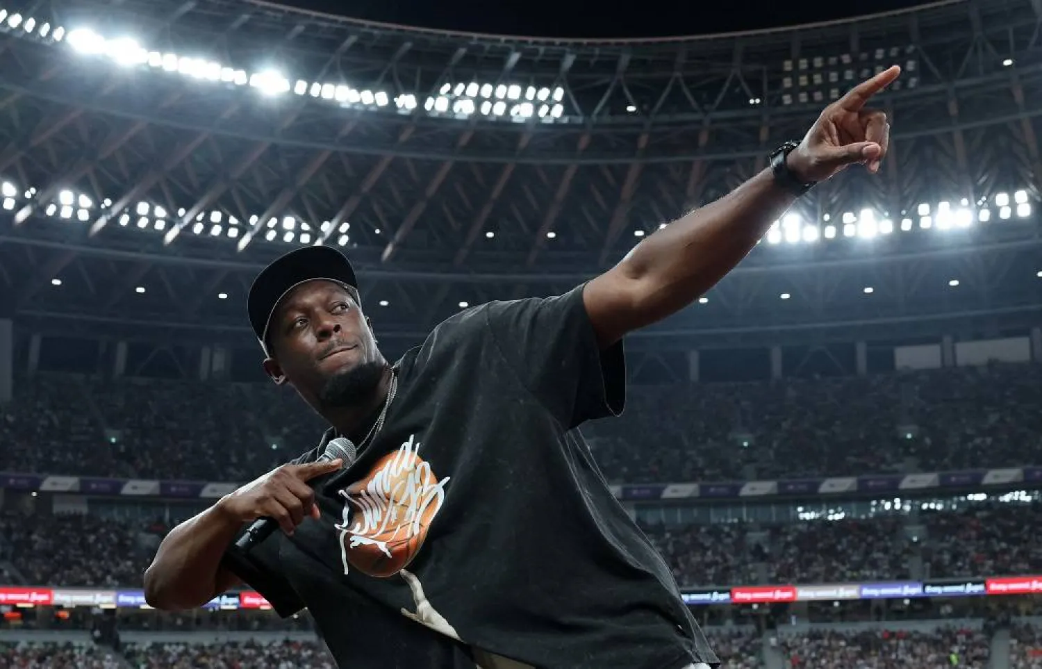 World Athletics Championships Tokyo 2025 - Men's 10,000m Final - Japan National Stadium, Tokyo, Japan - September 14, 2025 Former athlete Usain Bolt performs his signature pose to the crowd. (Reuters)