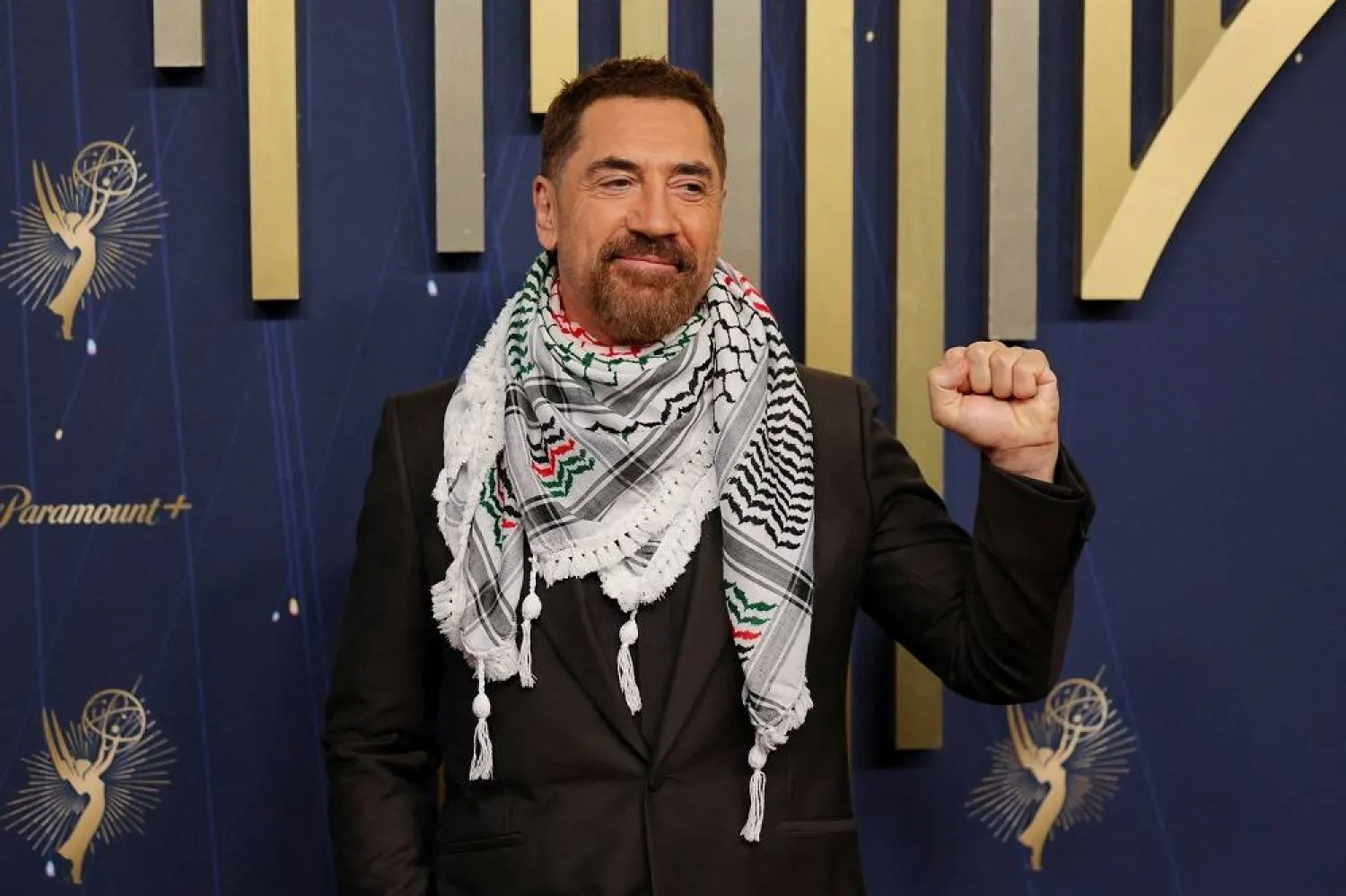Javier Bardem wears a keffiyeh as he poses on the red carpet at the 77th Primetime Emmy Awards in Los Angeles, California, US, September 14, 2025. (Reuters)