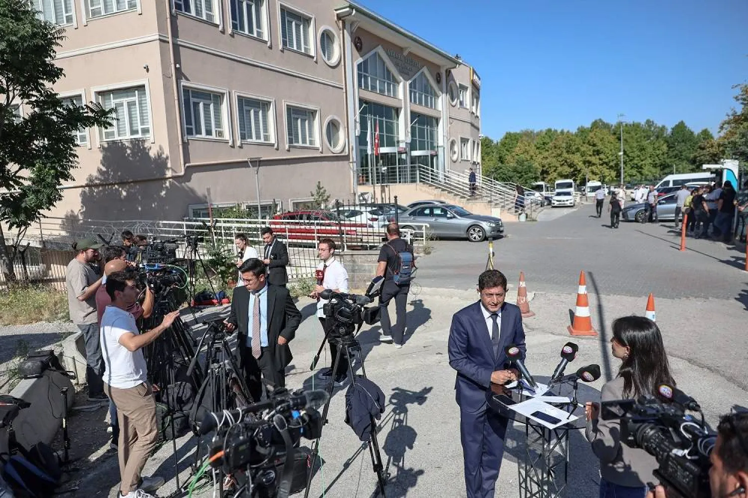 Journalists wait outside the court in Ankara, where a hearing on corruption charges could upend the leadership of Türkiye's main opposition party, Republican People's Party (CHP), in Ankara on September 15, 2025. (AFP)
