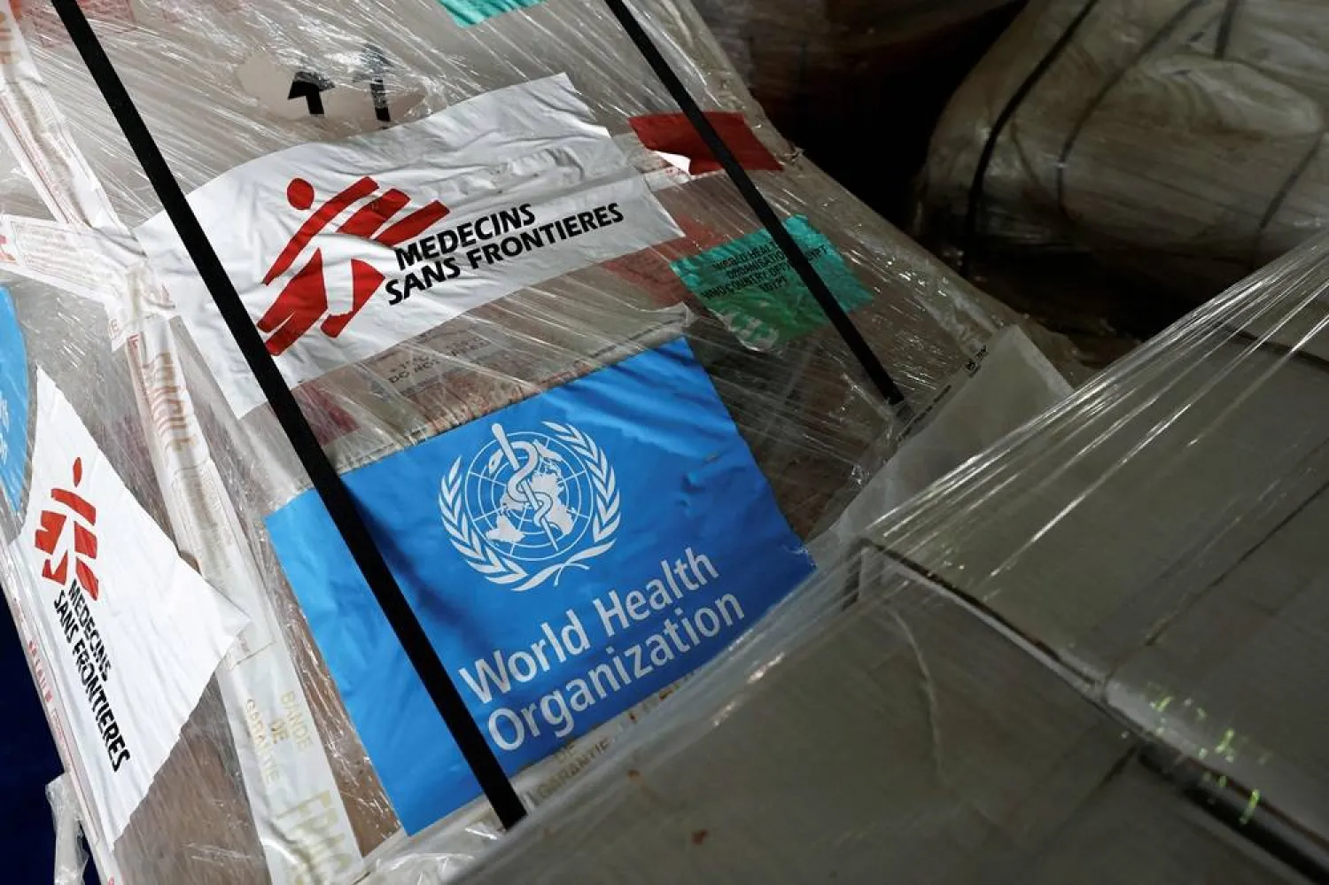 MSF (Médecins Sans Frontières - Doctors without borders) logo and World Health Organization (WHO) logo are seen on humanitarian supplies for Gaza stored at Egyptian Red Crescent warehouses storing aid for Gaza, in the Egyptian border town of El-Arish, on April 8, 2025. (AFP) 