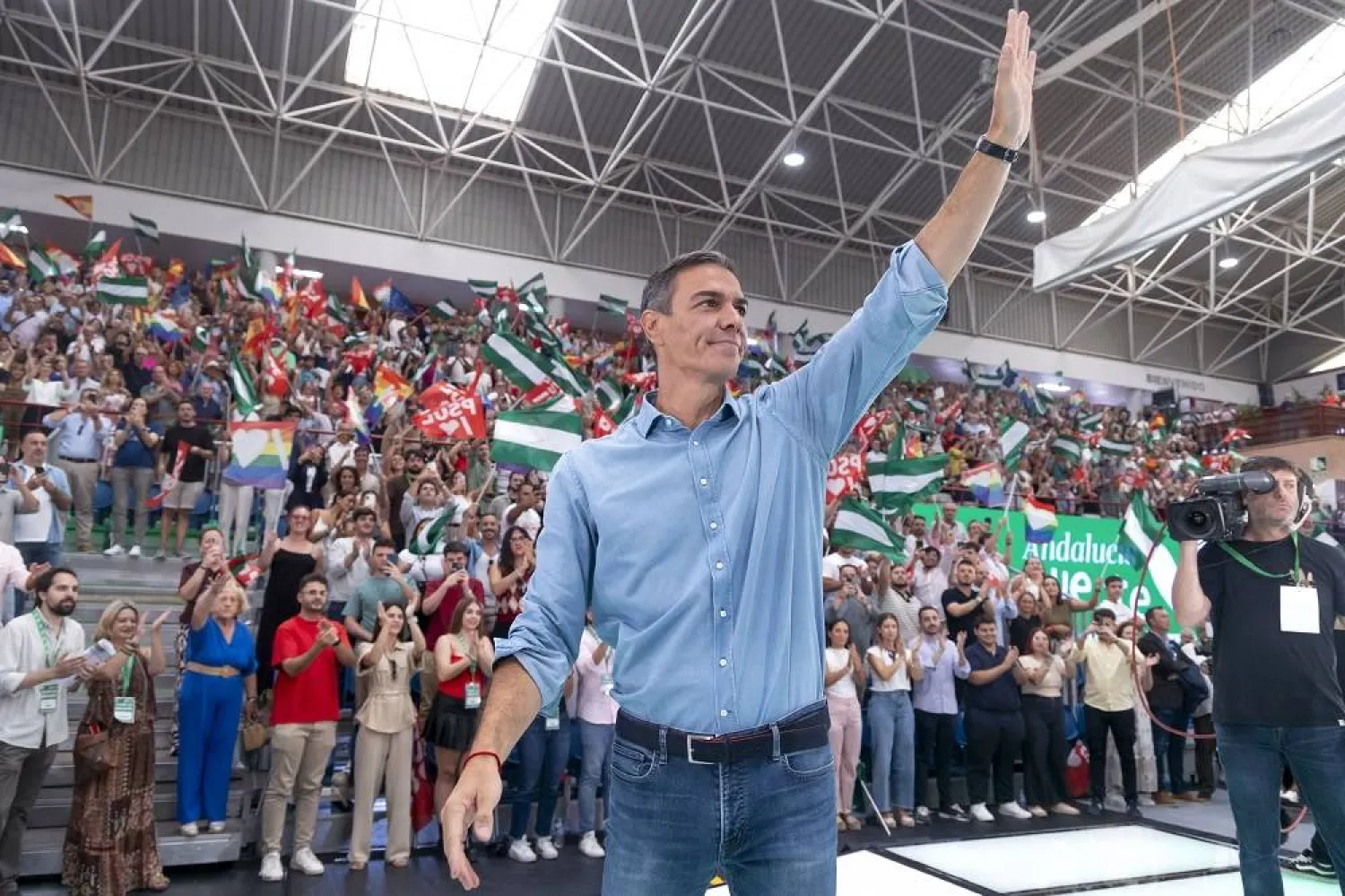 Spanish Prime Minister and Socialist Party's leader, Pedro Sanchez, greets as he attends a party's event in Malaga, southern Spain, 14 September 2025. (EPA)