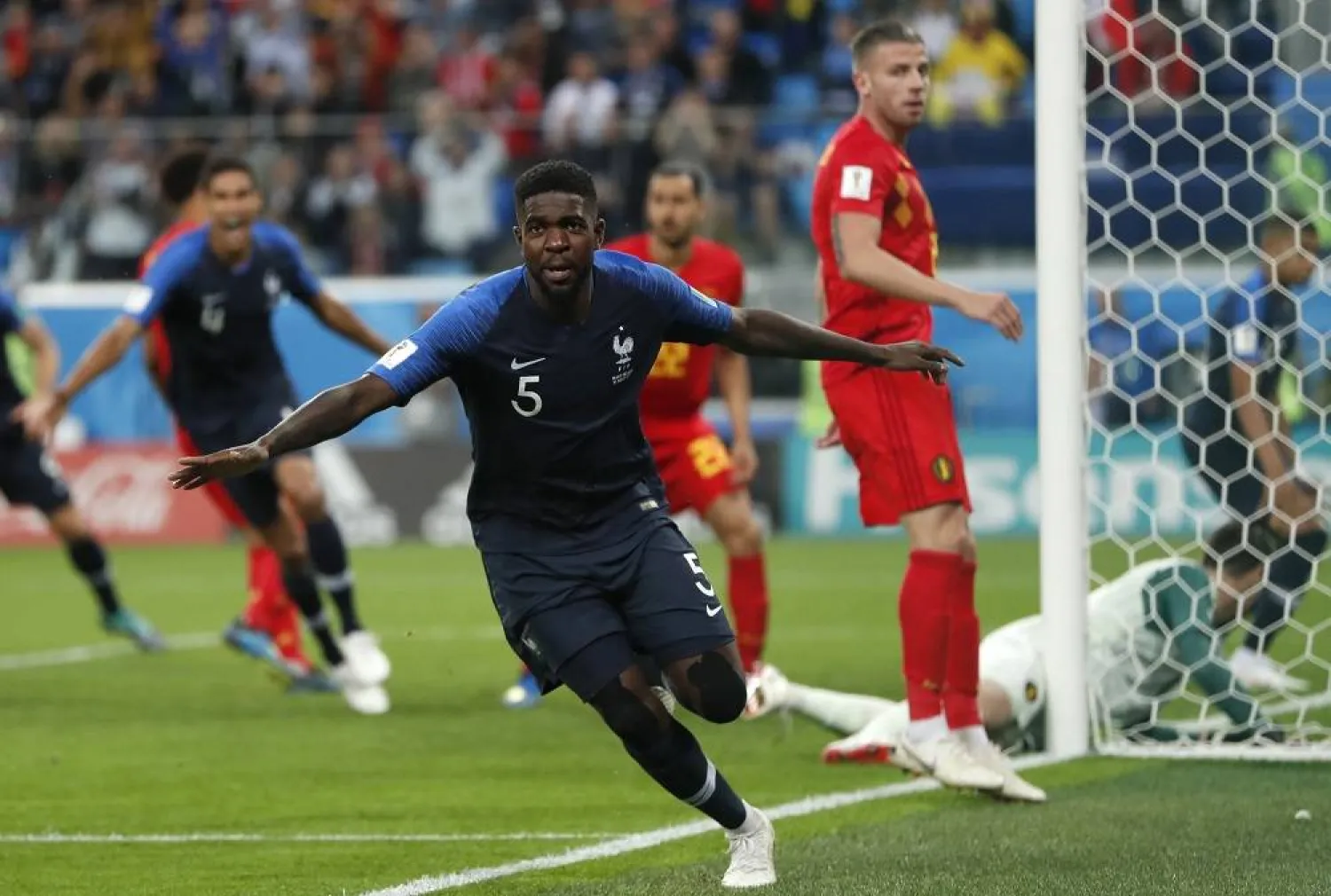 France's Samuel Umtiti celebrates after scoring his sides 1st goal of the game during the semifinal match between France and Belgium at the 2018 soccer World Cup in the St. Petersburg Stadium in, St. Petersburg, Russia, Tuesday, July 10, 2018. (AP)