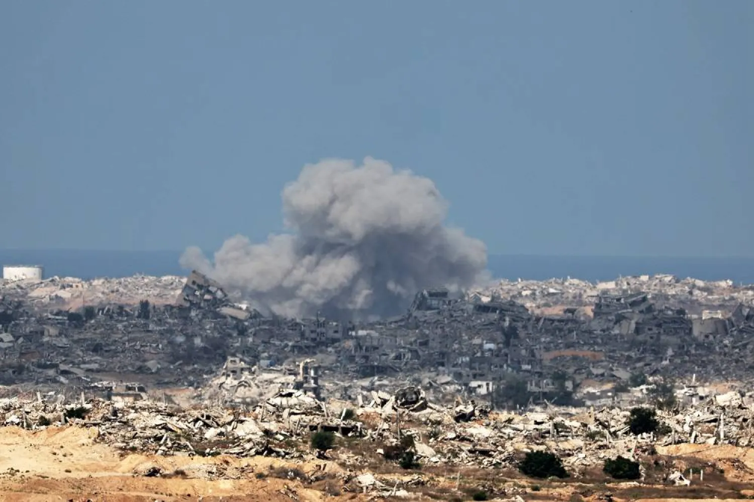 Smoke rises after an Israeli airstrike on the outskirts of Gaza City, as seen from an undisclosed location on the Israeli side of the border, 16 September 2025. (EPA)