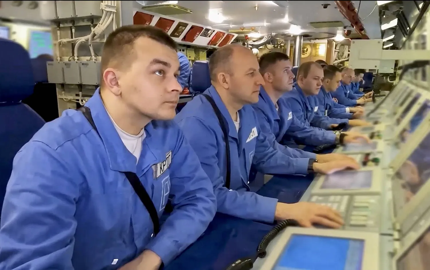 A still image taken from a handout video provided on 15 September 2025 by the Russian Defense Ministry press service shows crew members of the Arkhangelsk nuclear-powered attack submarine taking part in the Zapad-2025 (West-2025) joint military drills at an undisclosed location in Russia. (EPA/Russian Defense Ministry Press Service Handout)