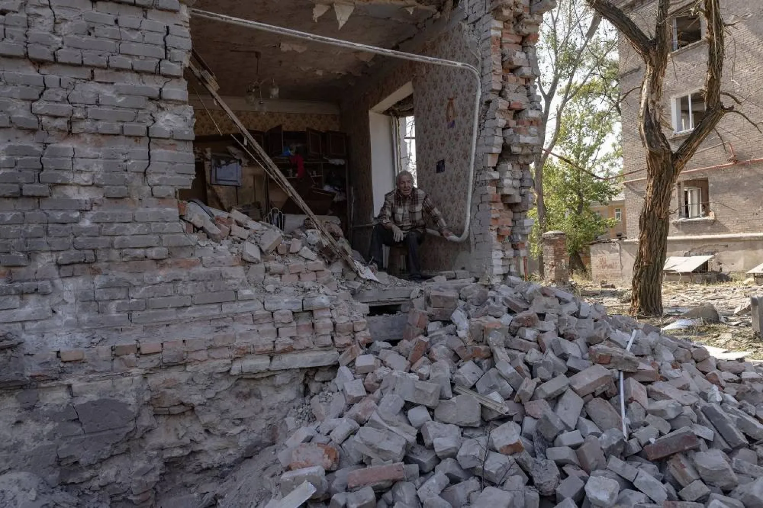 A resident looks on from his damaged apartment in the frontline town of Kostiantynivka, amid Russia's attack on Ukraine, in Donetsk region, Ukraine September 16, 2025. (Reuters)