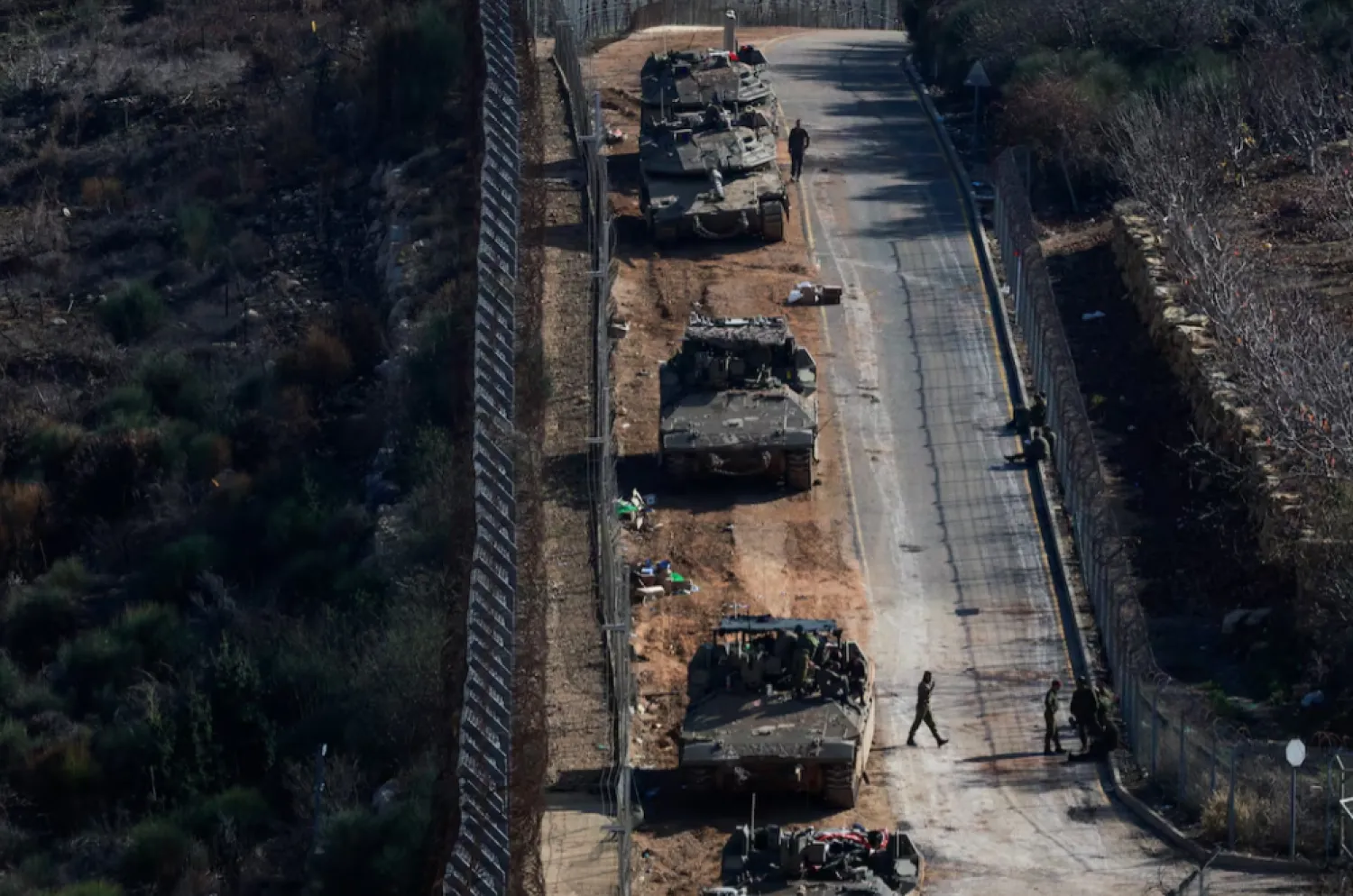Israeli soldiers gather near the ceasefire line between Syria and the Israeli-occupied Golan Heights, December 9, 2024. REUTERS/Ammar Awad 