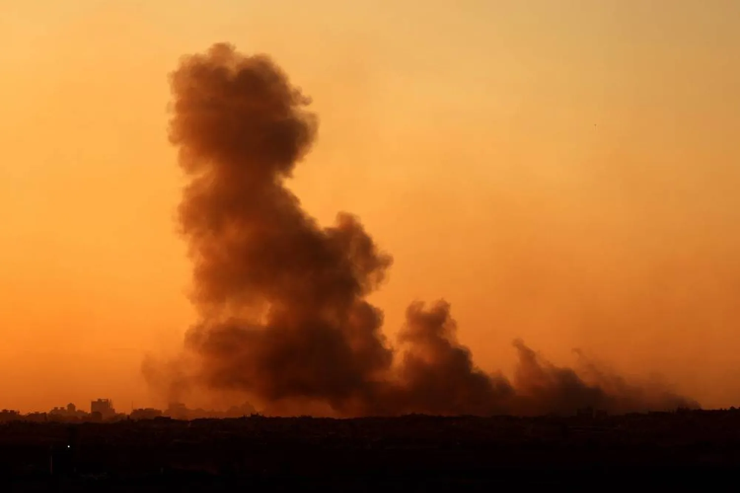 This picture taken from a position at Israel's border with the Gaza Strip shows smoke billowing during an Israeli strike on the besieged Palestinian territory on September 17, 2025. (AFP)