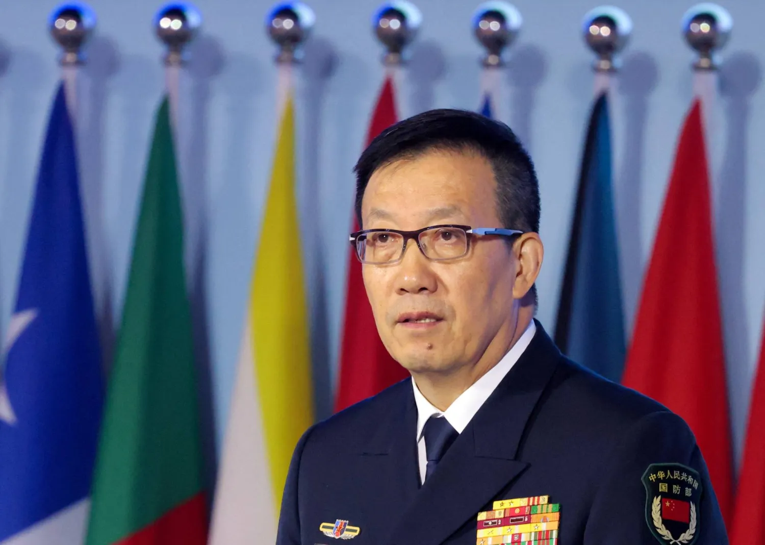وزير الدفاع الصيني دونغ جون يتحدث خلال «منتدى شيانغشان» في بكين (رويترز)