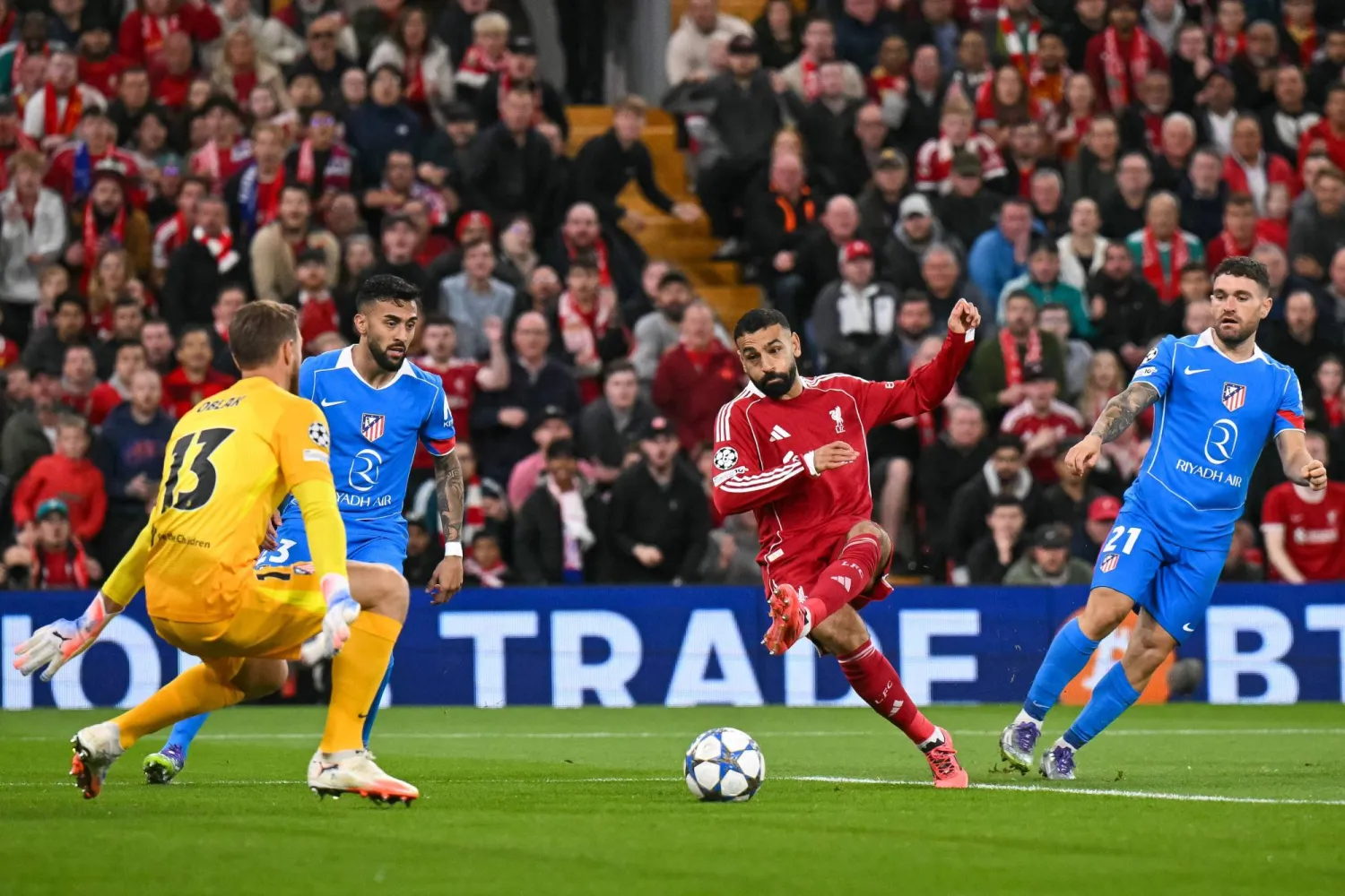 Liverpool's Egyptian striker #11 Mohamed Salah (C) scores his team's second goal against Atletico Madrid's Slovenian goalkeeper #13 Jan Oblak during the UEFA Champions League first round football match between Liverpool and Atletico Madrid at Anfield in Liverpool, north west England on September 17, 2025. (Photo by Oli SCARFF / AFP)