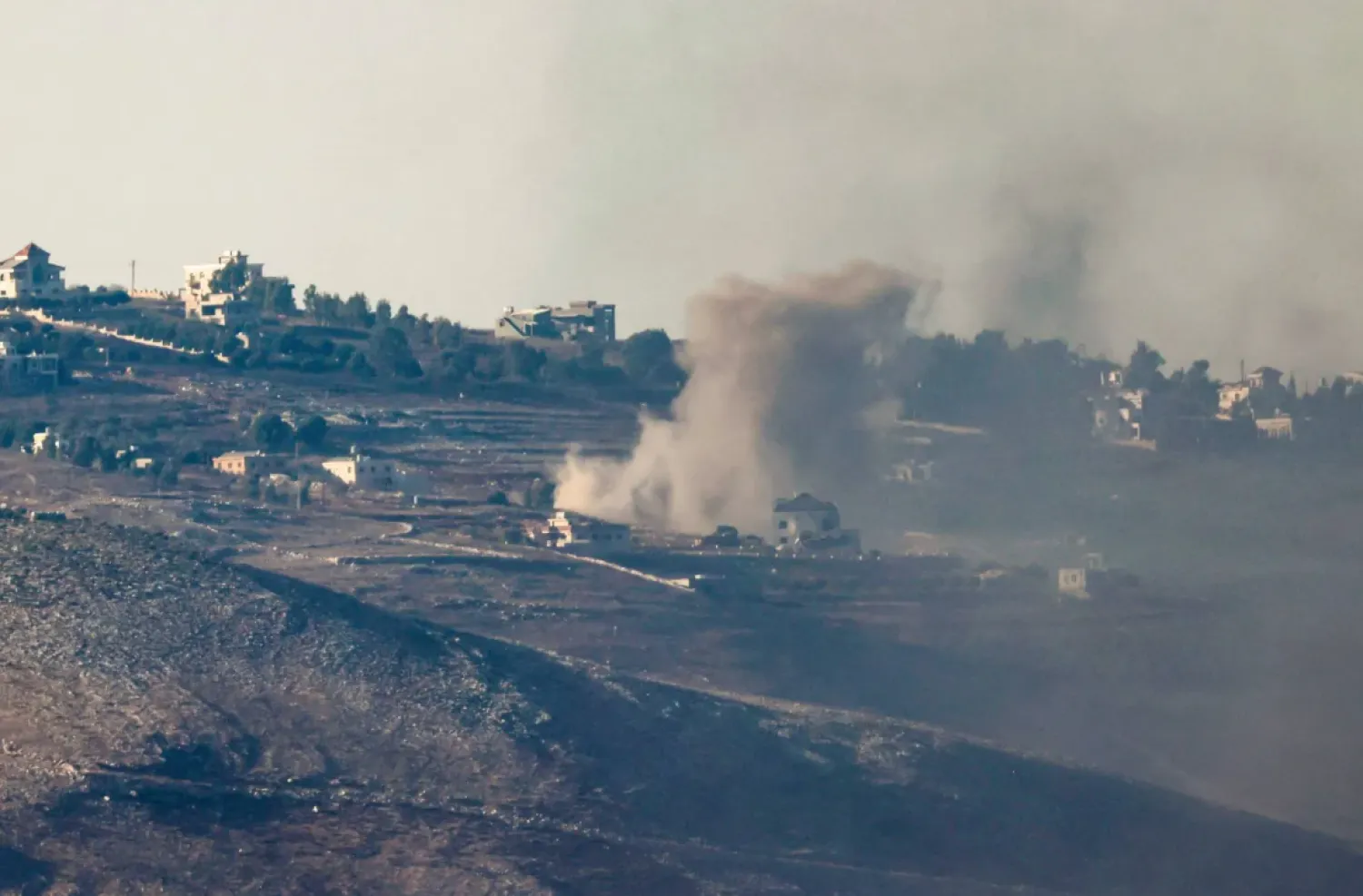 A picture taken from northern Israel along the border with southern Lebanon shows smoke billowing above south Lebanon during Israeli bombardment on October 4, 2024. (Photo by Jalaa MAREY / AFP)