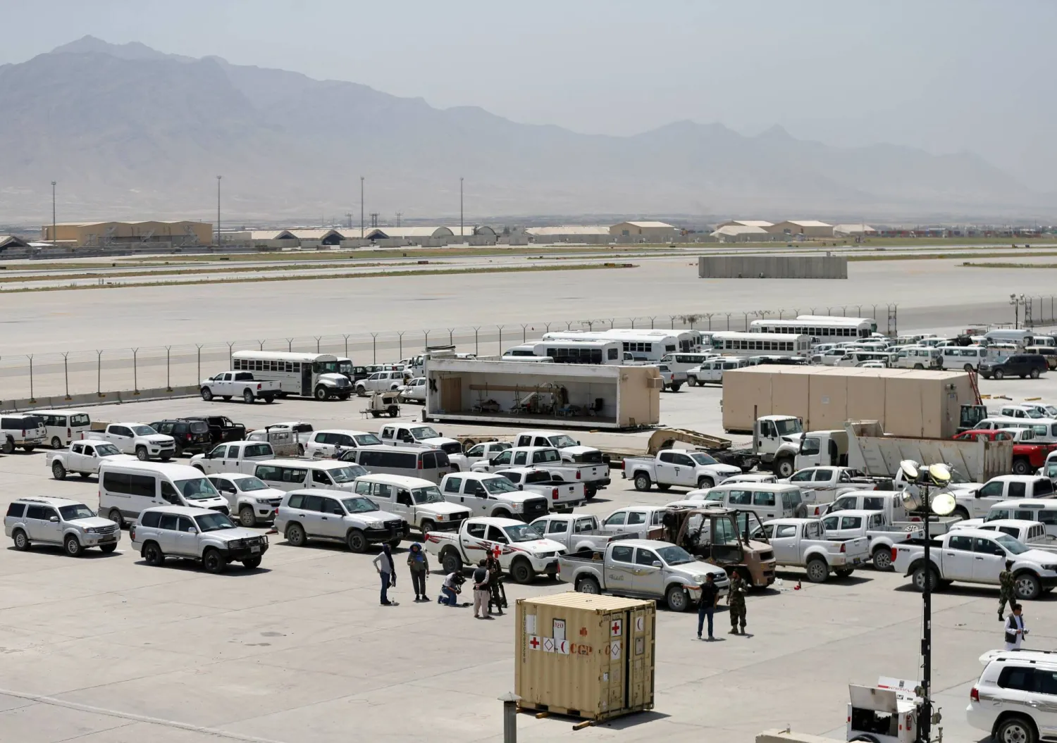 FILE PHOTO: Parked vehicles are seen in Bagram US air base, after American troops vacated it, in Parwan province, Afghanistan July 5, 2021. REUTERS/Mohammad Ismail/File Photo