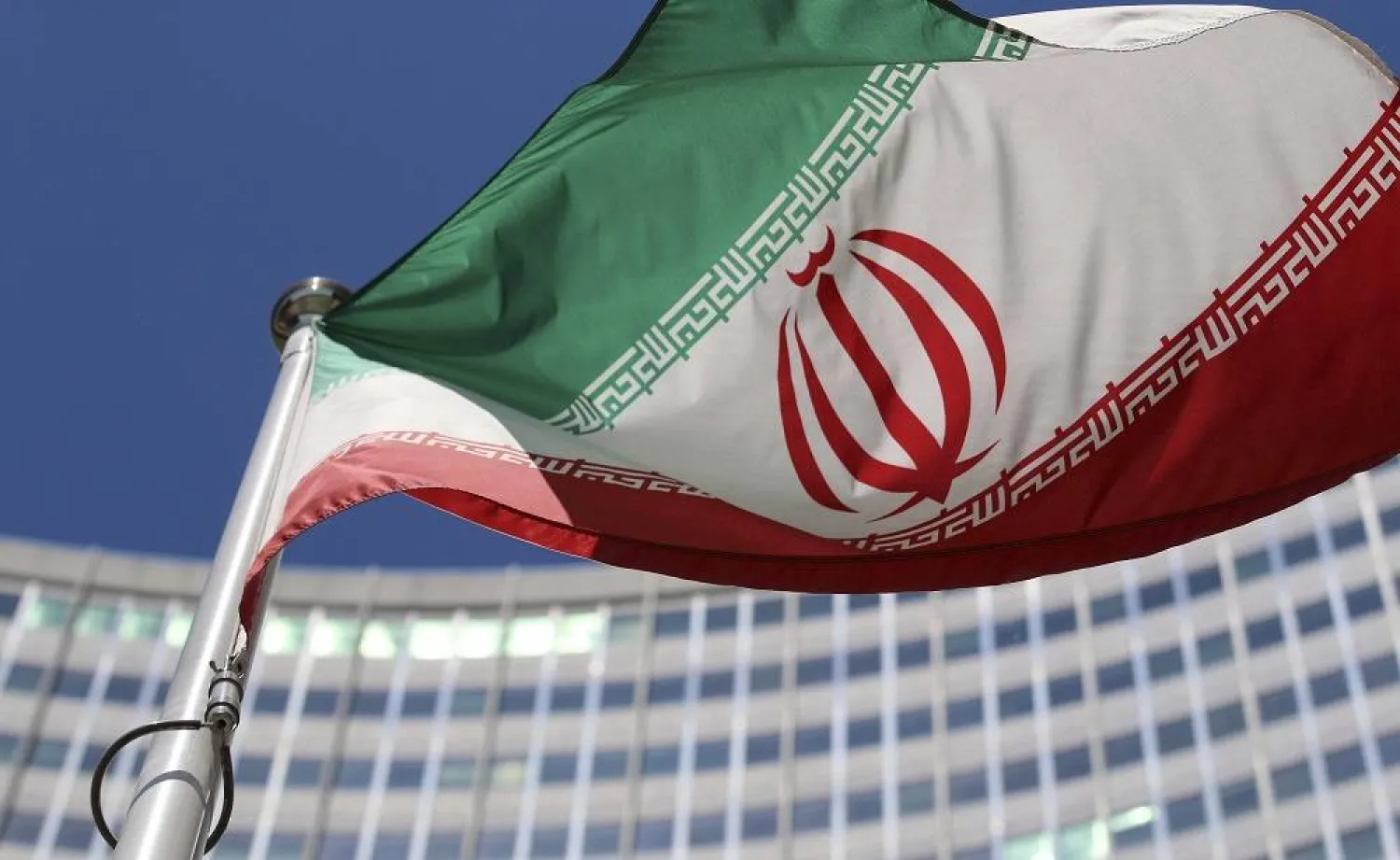 The Iranian flag flies in front of a UN building where closed-door nuclear talks take place at the International Center in Vienna, Austria, on June 18, 2014. (AP)