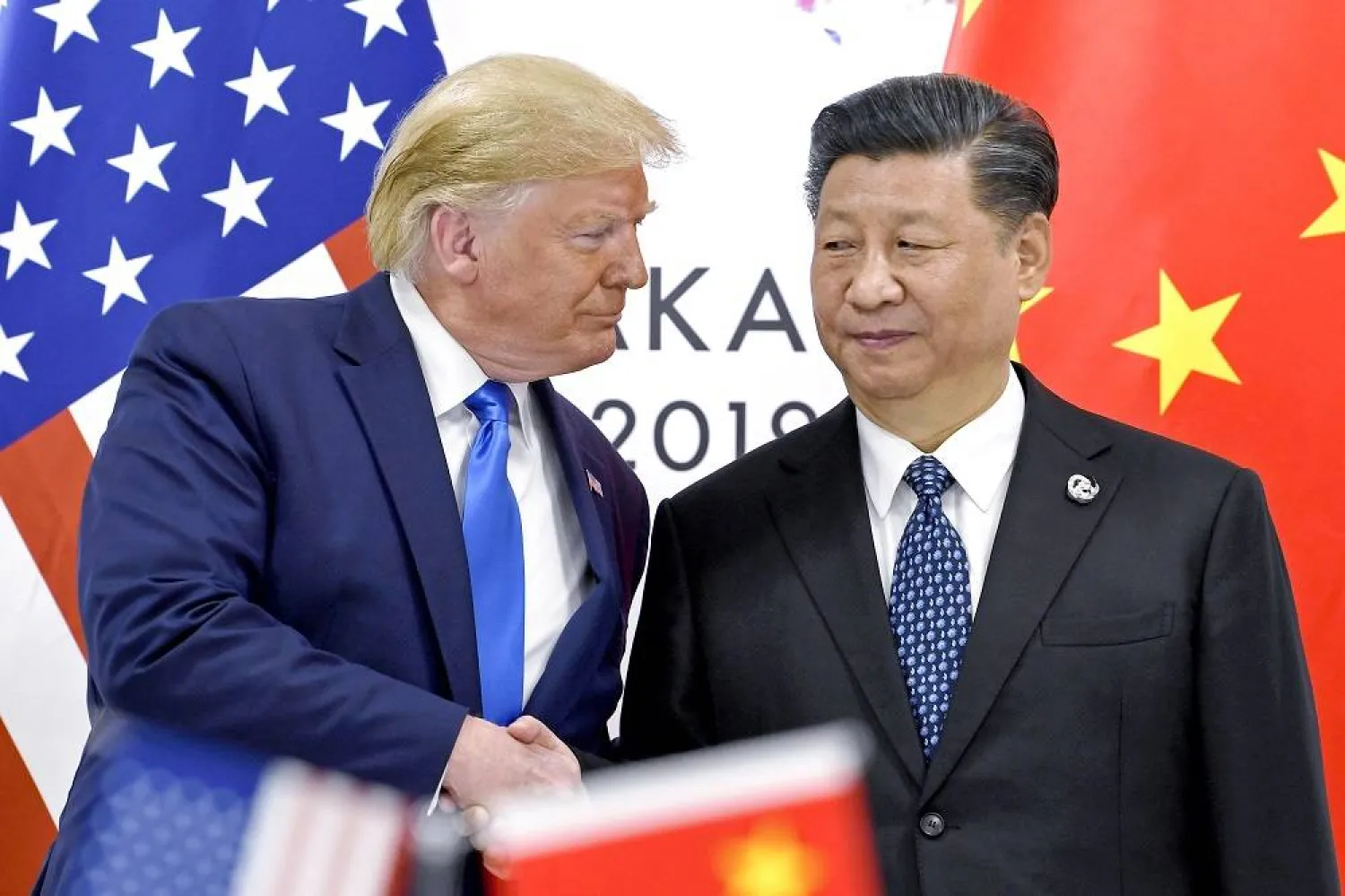 President Donald Trump, left, shakes hands with China's President Xi Jinping during a meeting on the sidelines of the G20 summit in Osaka, Japan, June 29, 2019. (AP)