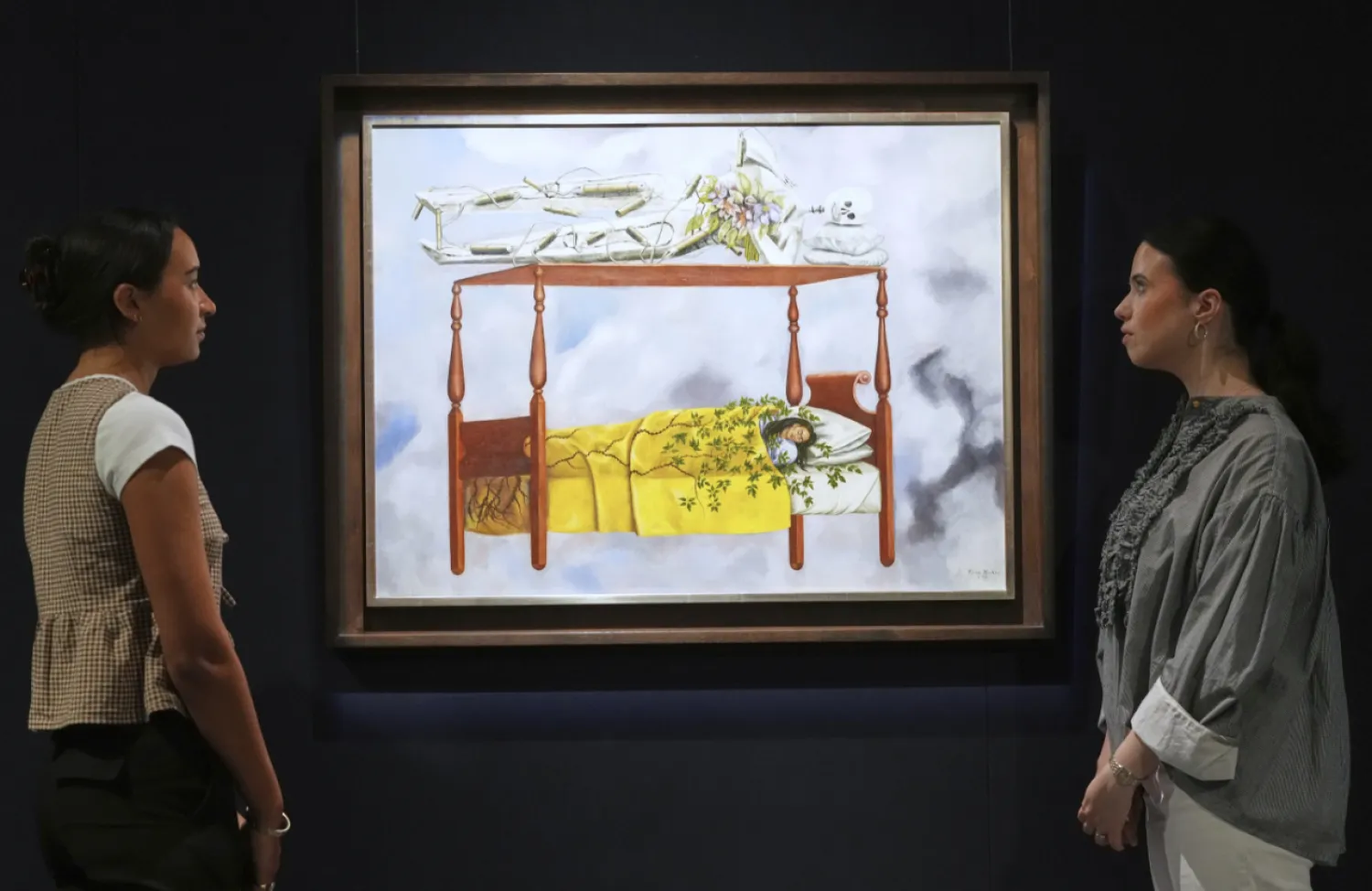 A painting by Frida Kahlo called El sueño (La cama) is displayed at Sotheby's auction rooms, the painting estimated at 40-60 million US dollars is part of a collection of surrealist masterpieces unveiled in London ahead of their sale in New York, Friday, Sept. 19, 2025. (AP Photo/Kirsty Wigglesworth)