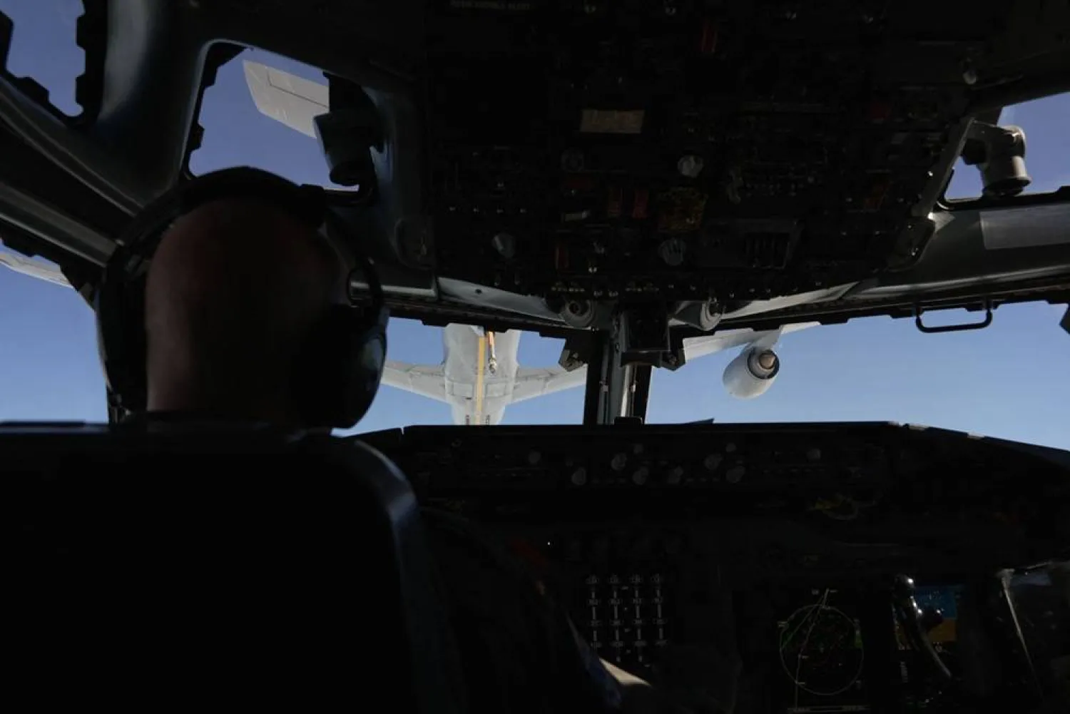 A NATO AWACS surveillance instructor pilot navigates an AWACS (Airborne Warning and Control System) NATO air surveillance aircraft during a flight over Polish airspace as part of the alliance's new Eastern Sentry mission on September 19, 2025. (AFP) 