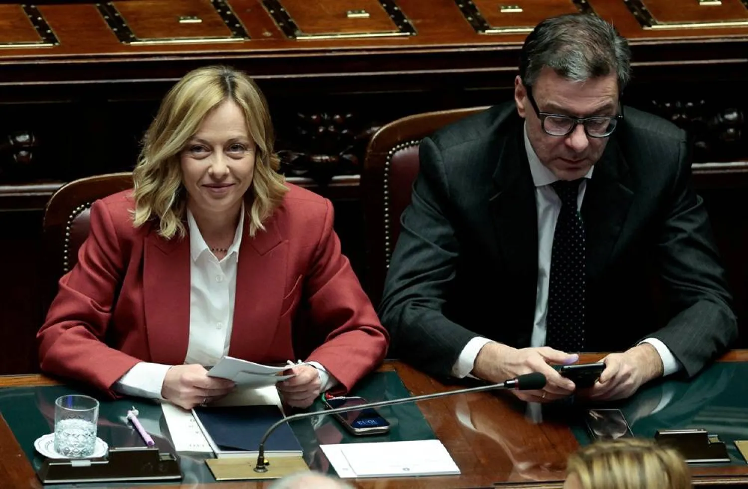 Italy's Prime Minister Giorgia Meloni and Economy Minister Giancarlo Giorgetti attend a session at the lower house of parliament in Rome, Italy, December 17, 2024. (Reuters)