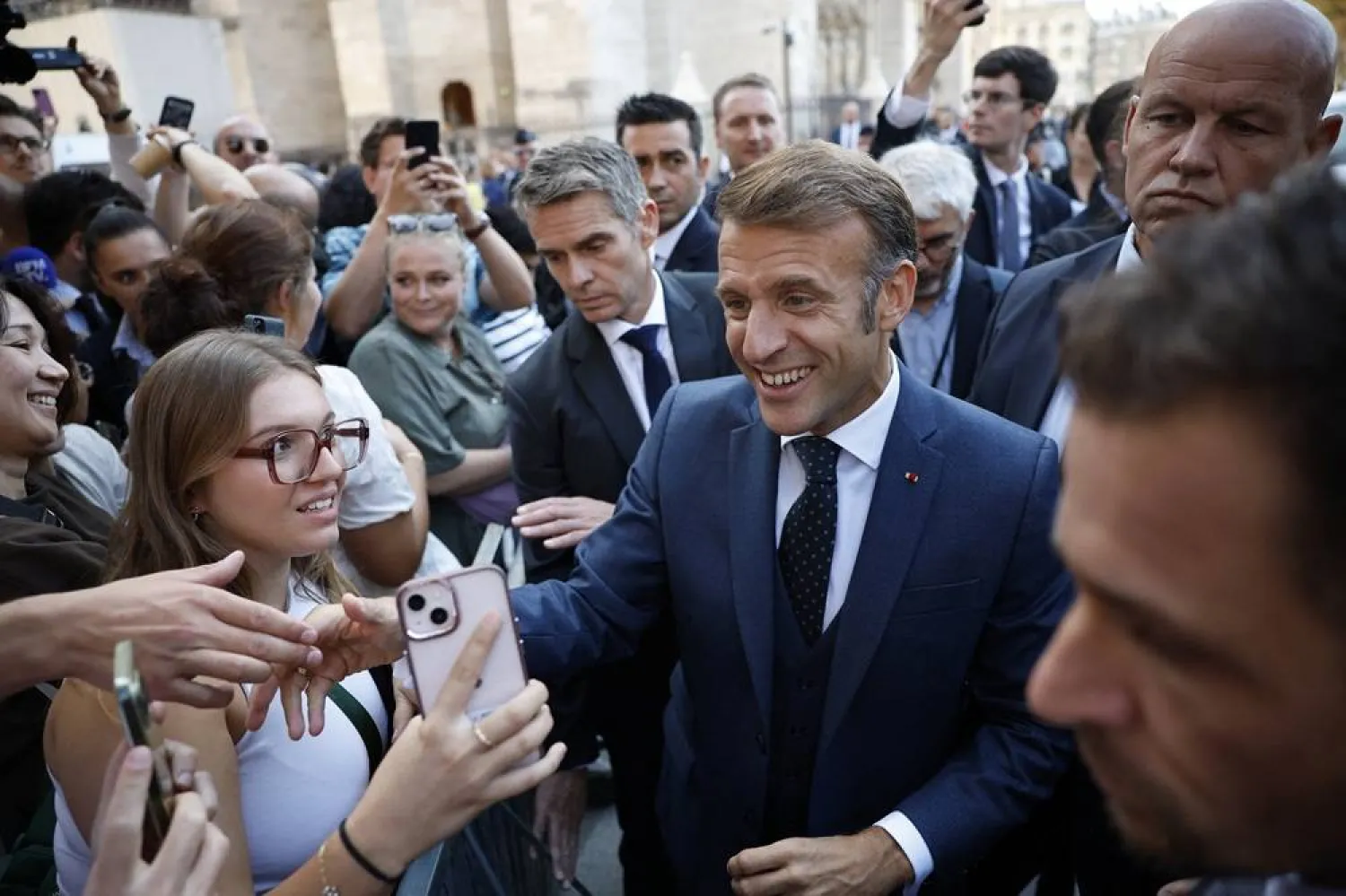 French President Emmanuel Macron shakes hands after his visit to Notre-Dame de Paris Cathedral ahead of Local Heritage Days to celebrate the reopening of the cathedral's Towers to visitors in Paris, France, 19 September 2025. (Reuters) 