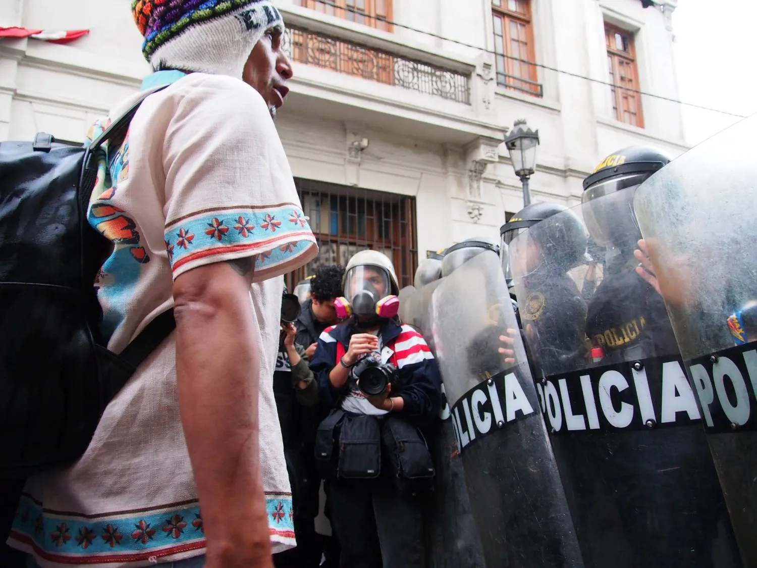 20 September 2025, Peru, Lima: A protestor faces the police during a march in Lima against the government of Dina Boluarte, the Congress and the Judiciary system. Photo: Carlos Garcia Granthon/ZUMA Press Wire/dpa