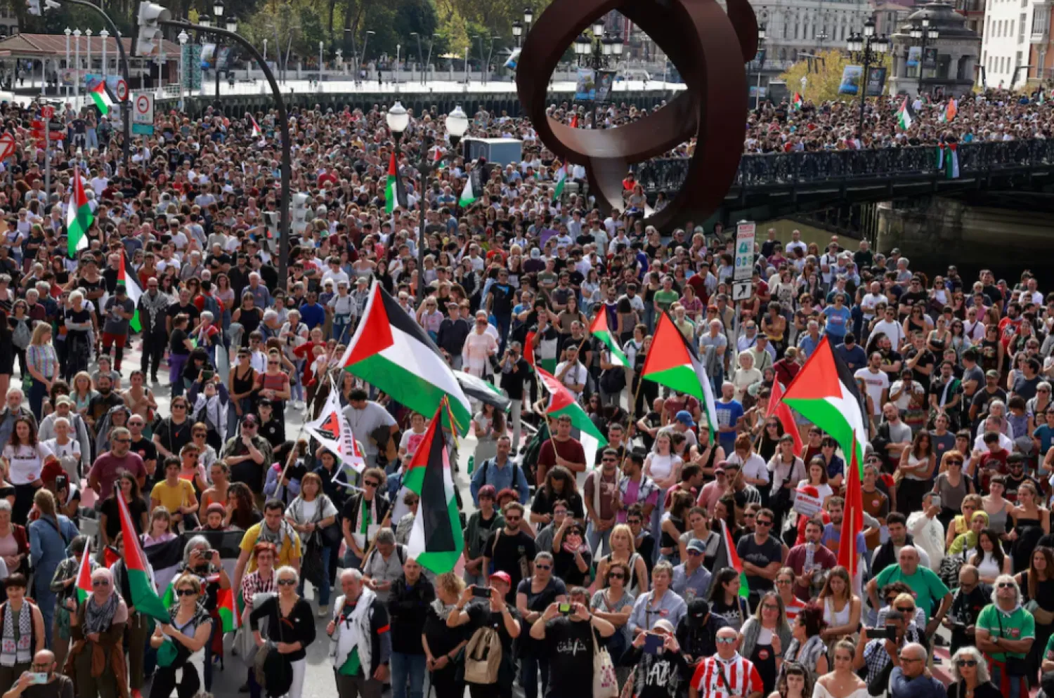 People hold flags during a demonstration in support of Palestinians, orgsanised by Palestinarekin Elkartasuna (Solidarity With Palestine), in Bilbao, Spain, October 5, 2024. REUTERS/Vincent West 