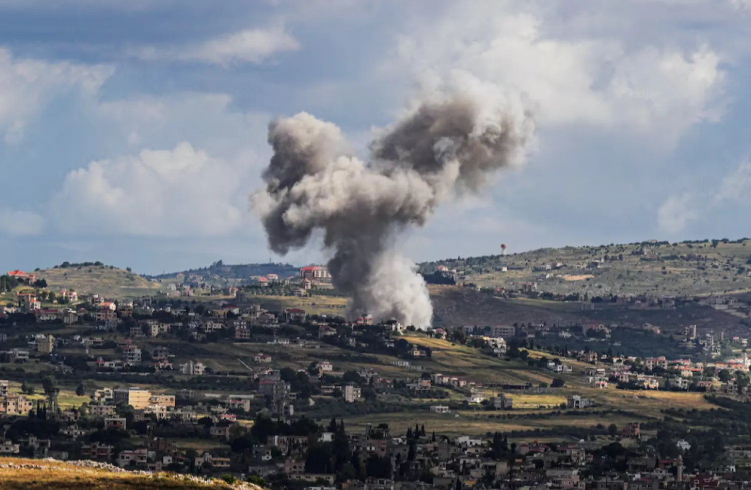 Smoke rises above Lebanon, following an Israeli strike, amid ongoing cross-border hostilities between Hezbollah and Israeli forces, as seen from Israel's border with Lebanon in northern Israel, May 5, 2024. REUTERS/Ayal Margolin /File Photo 