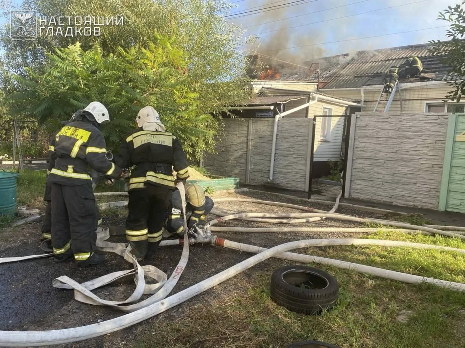 In this photo released by Belgorod regional governor Vyacheslav Gladkov's Telegram channel on Wednesday, Sept. 10, 2025, firefighters extinguish a burning private house after a drone attack by the Armed Forces of Ukraine in the city of Belgorod, Russia. (Belgorod Region Governor Vyacheslav Gladkov Telegram channel via AP)