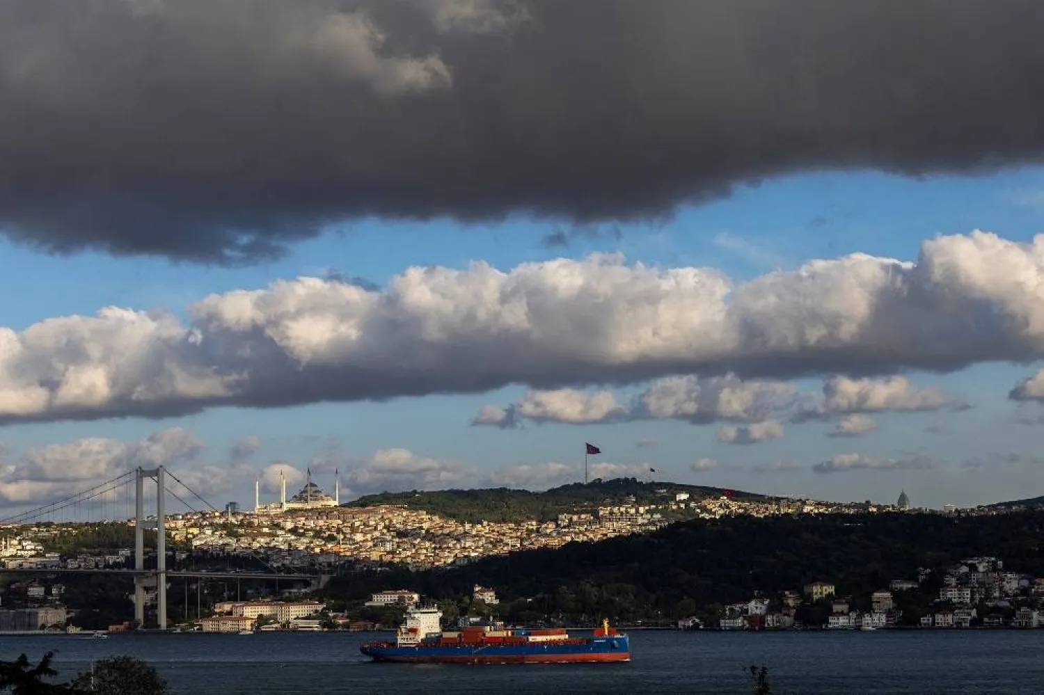 Antigua and Barbuda-flagged cargo ship Siargao sails as clouds gather over the Bosphorus in Istanbul, Türkiye, in Istanbul, September 15, 2025. (Reuters) 