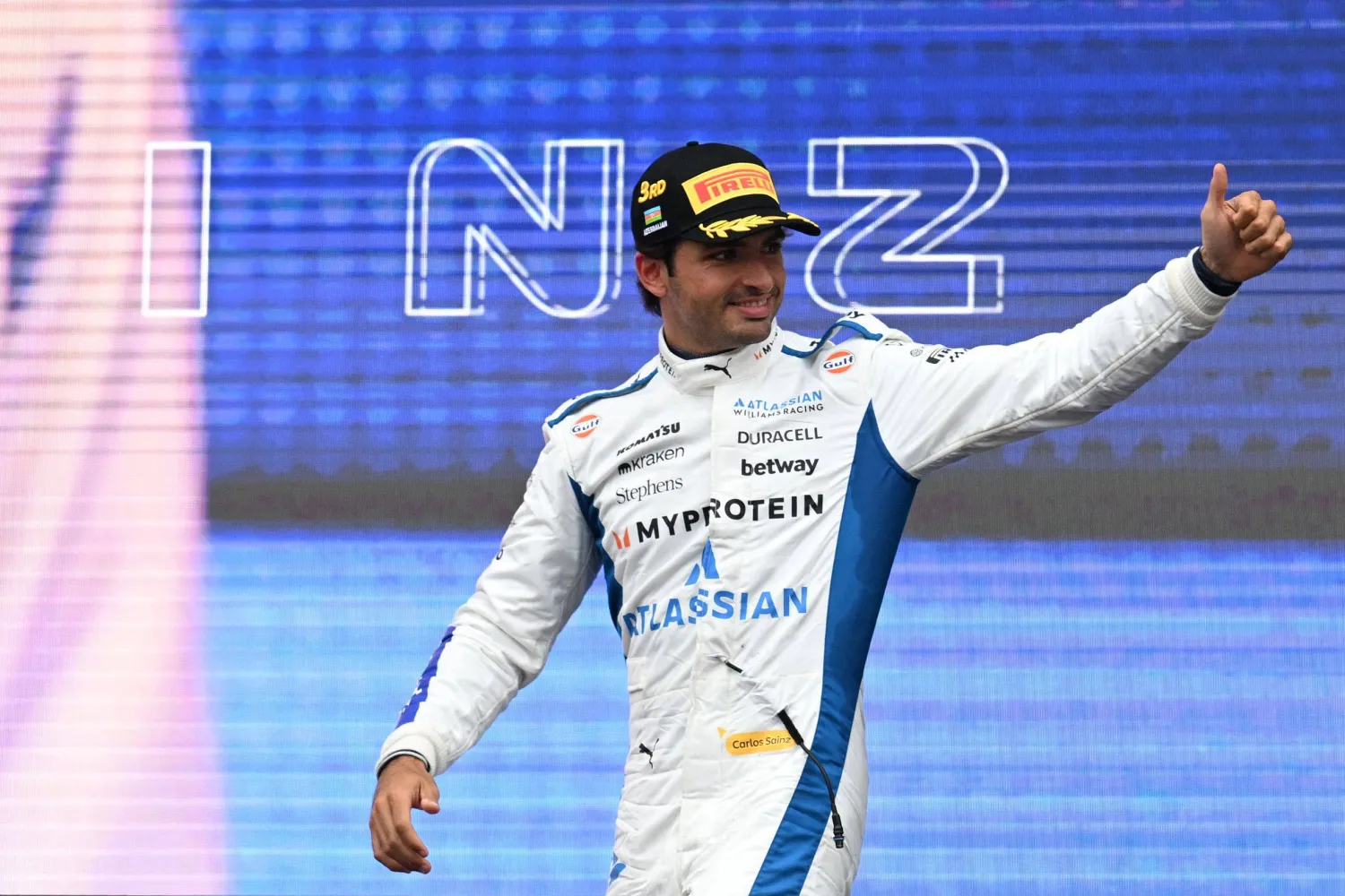 Third-placed Williams' Spanish driver Carlos Sainz arrives for the podium ceremony after the Formula One Azerbaijan Grand Prix at the Baku City Circuit in Baku on September 21, 2025. (AFP)
