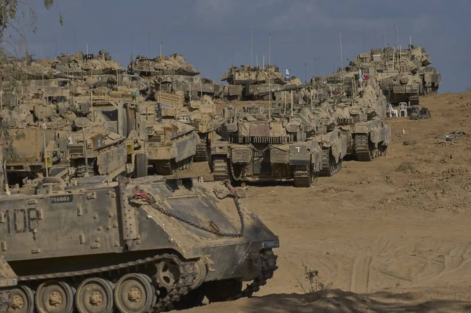 Israeli tanks at a staging area near the border with the Gaza Strip, in southern Israel, Sunday, Sept. 21, 2025. (AP)