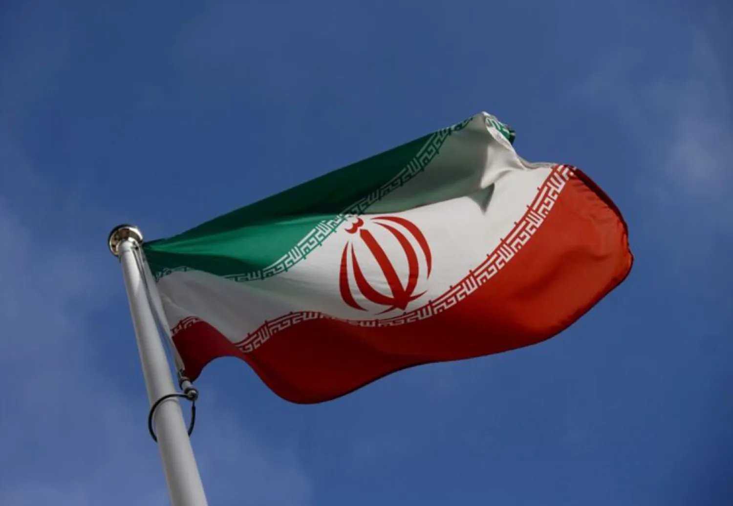 The Iranian flag waves in front of the International Atomic Energy Agency (IAEA) headquarters, before the beginning of a board of governors meeting, in Vienna, Austria, March 1, 2021. REUTERS/Lisi Niesner