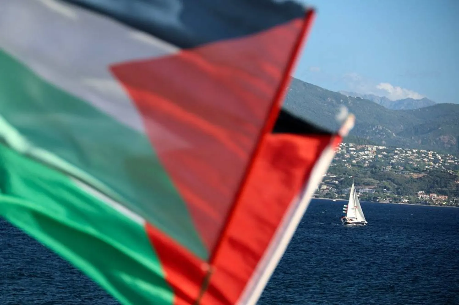 This photograph shows Palestinian flags waging as a flotilla depart for Gaza carrying humanitarian aid and activists vowing to try "to break the siege of Gaza", in Ajaccio, on the French Mediterranean island of Corsica, on September 12, 2025. (AFP)