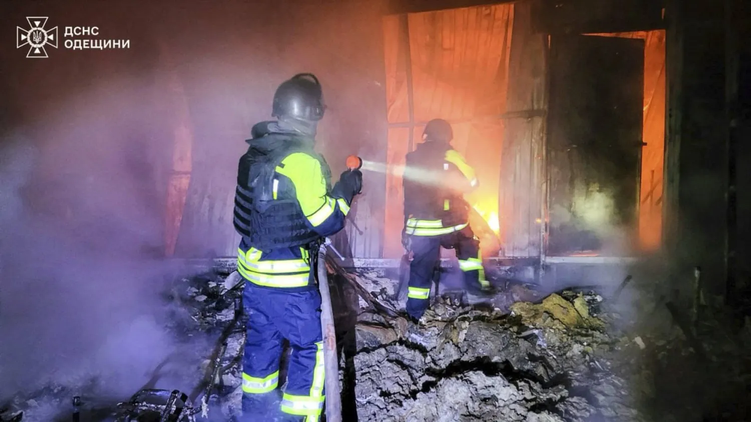 In this photo provided by the Ukrainian Emergency Service, firefighters put out the fire following a Russian missile attack in Tatarbunary, Odesa region, Ukraine, Tuesday, Sept. 23, 2025. (Ukrainian Emergency Service via AP)
