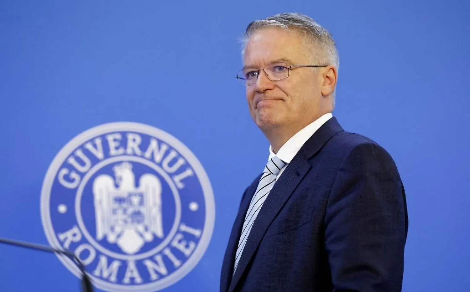 Secretary-General of the Organization for Economic Cooperation and Development (OECD) Mathias Cormann, accompanied by Romanian Prime Minister Ilie Bolojan (not pictured), arrives for a joint media statement following their official meeting at the government headquarters in Bucharest, Romania, 15 September 2025. (EPA) 