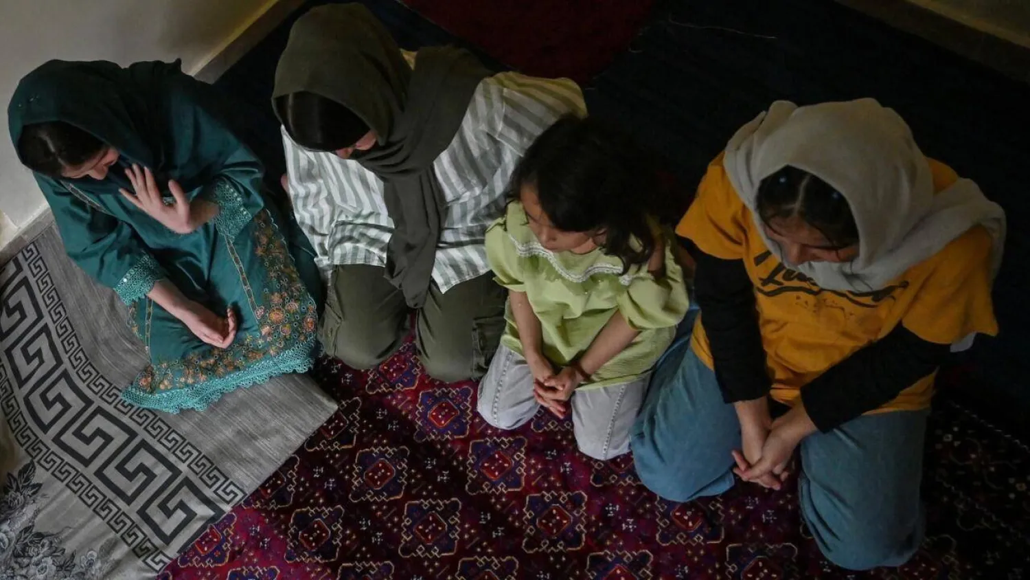 Refugee girls Shayma, Zahra, and Laylama at their residence in Islamabad. Farooq NAEEM / AFP
