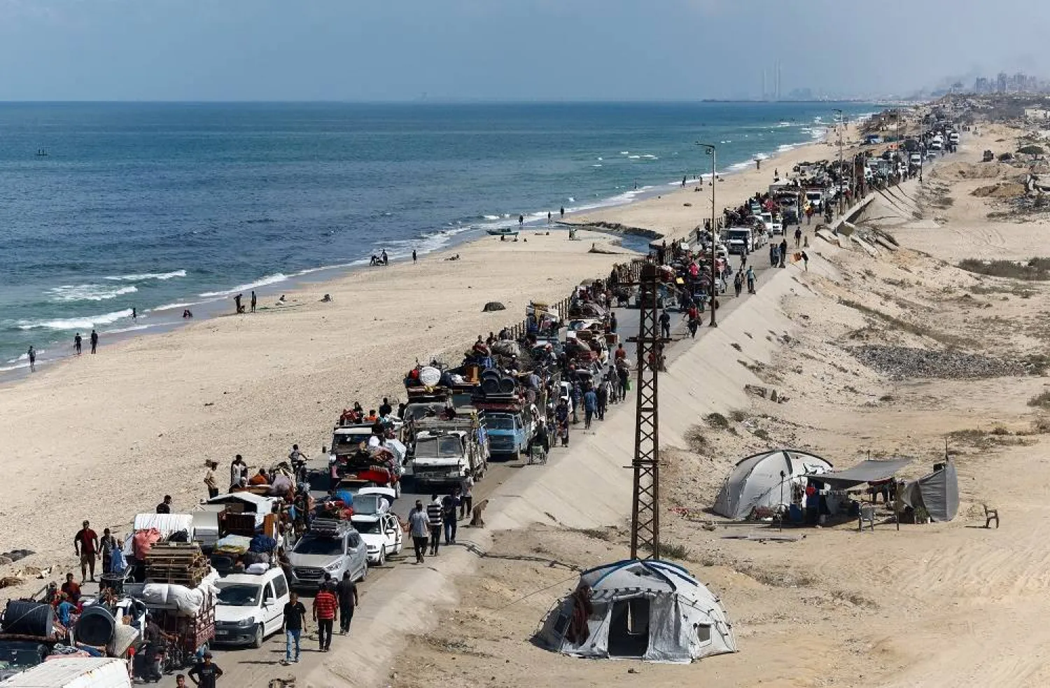 Displaced Palestinians, fleeing northern Gaza due to an Israeli military operation, move southward after Israeli forces ordered residents of Gaza City to evacuate to the south, in the central Gaza Strip, September 23, 2025. (Reuters)