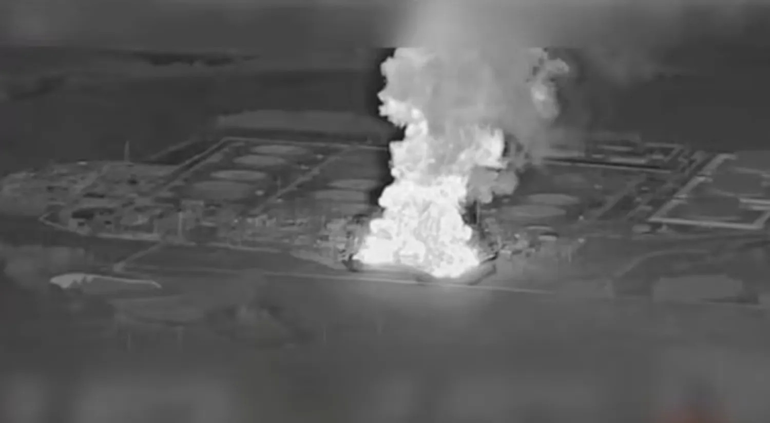 Smoke rises from the Unecha oil pumping station during a fire, in Unechsky district, Bryansk region, Russia, August 21, 2025 in this night vision still image obtained from social media video. YouTube @MAGYARBIRDS via REUTERS/File Photo 