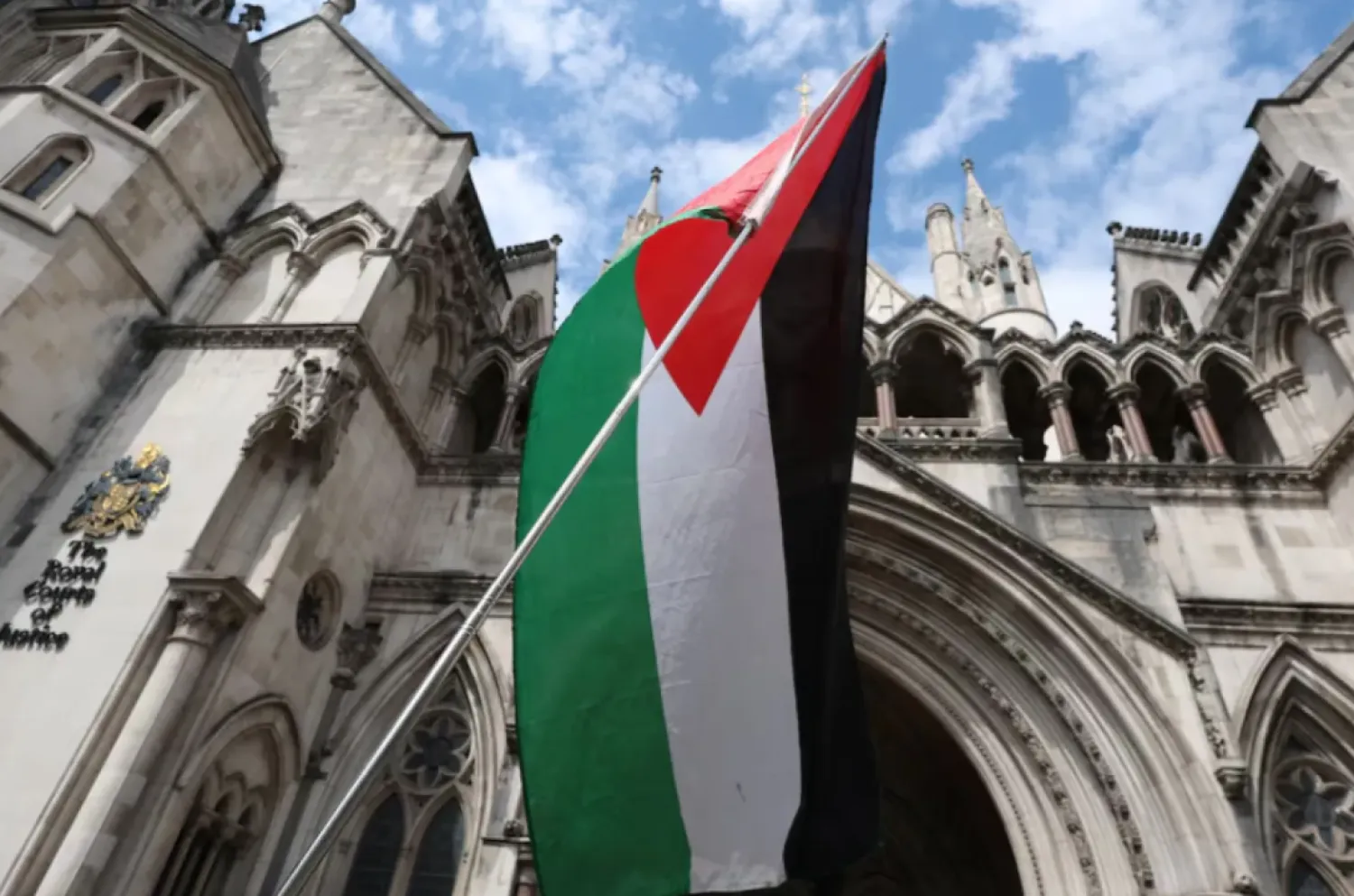 A Palestinian flag is seen, outside London's High Court as judges decide whether the co-founder of Palestine Action can challenge the UK government's ban on the group, in London, Britain, July 30, 2025. REUTERS/Toby Melville
