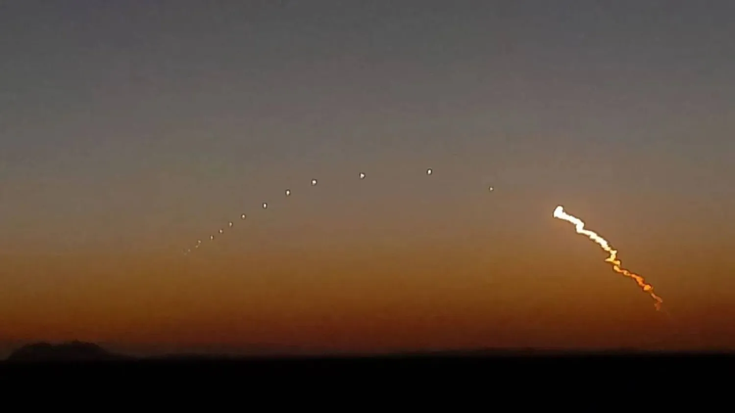 Iran test fires a missile in this image grab from a video from the Fars news agency.