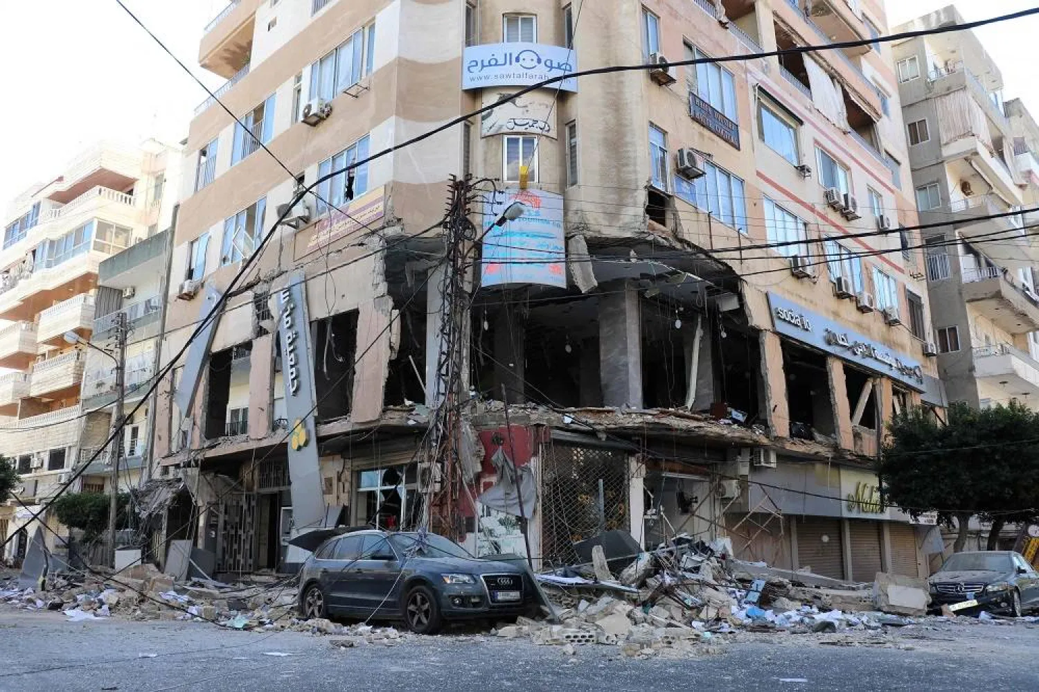 This picture shows a damaged building at the site of an overnight Israeli airstrike that targeted a branch of the Al-Qard al-Hassan finance group in the southern city of Tyre on October 21, 2024, amid the war between Israel and Hezbollah. (AFP)