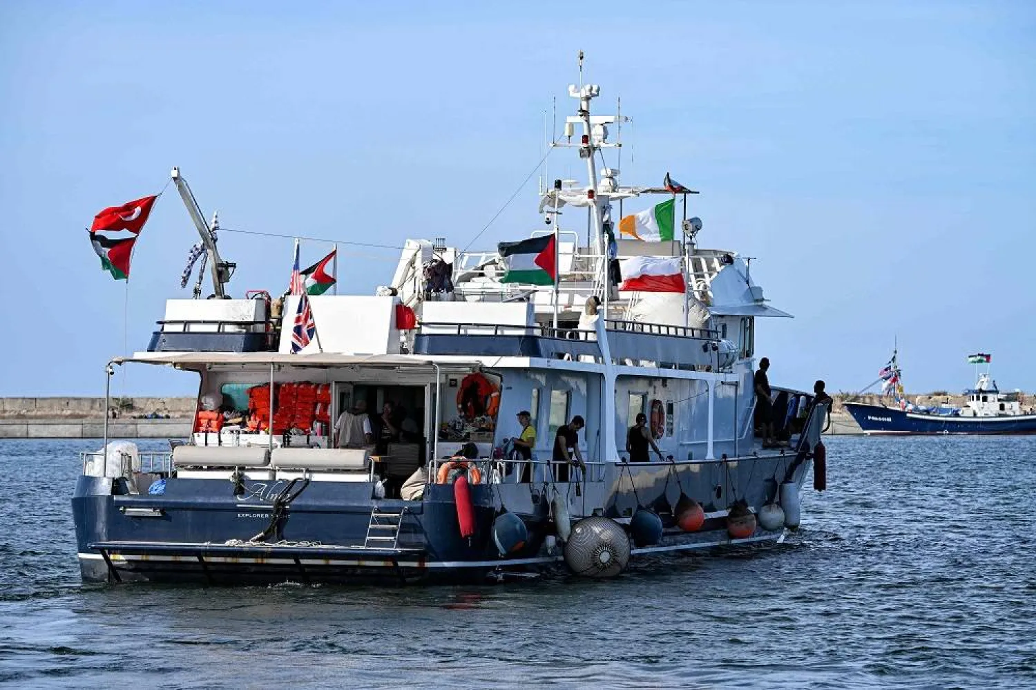 Activists and human rights defenders ride aboard the yacht Alma, departing from Tunisia's northern port of Bizerte, on September 14, 2025 to join the last boats taking part in the Global Sumud Flotilla, bound for the Gaza Strip to break Israel's blockade on the Palestinian territory. (AFP)