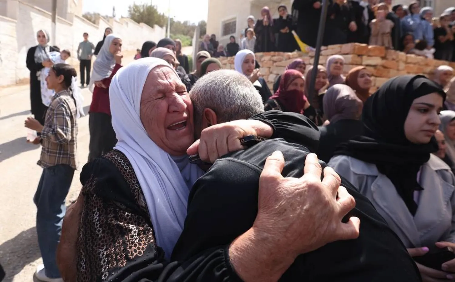Relatives of 20-year-old Said Murad al-Nassan mourn during his funeral in the village of Al-Mughayyir, near the West Bank city of Ramallah, 24 September 2025. (EPA)