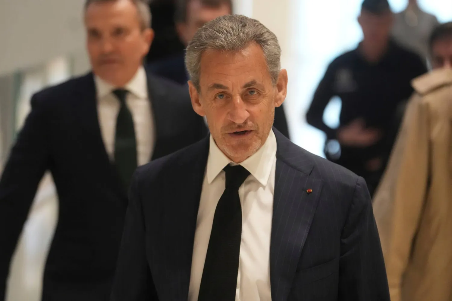 FILE - Former French President Nicolas Sarkozy arrives as he goes on trial over alleged illegal financing of his 2007 presidential campaign by the government of late Libyan leader Moammar Gadhafi, Monday, Jan. 6, 2025 in Paris. (AP Photo/Thibault Camus, File)