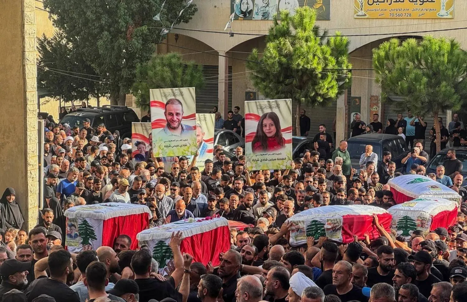 Mourners follow the coffins of five civilians killed in an Israeli strike on the border town of Bint Jbeil on Sunday (Reuters). 