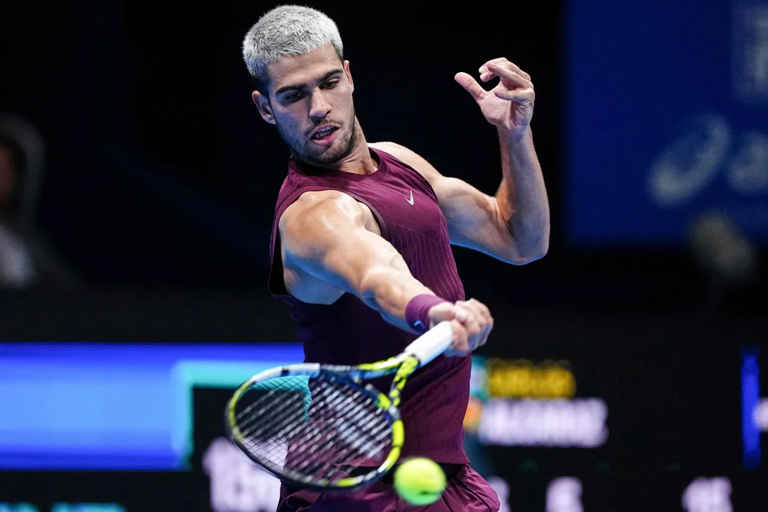 Spain's Carlos Alcaraz hits a return against Argentina's Sebastian Baez during their men's singles round-of-32 match at the ATP Japan Open tennis tournament in Tokyo on September 25, 2025. (Photo by Yuichi YAMAZAKI / AFP)